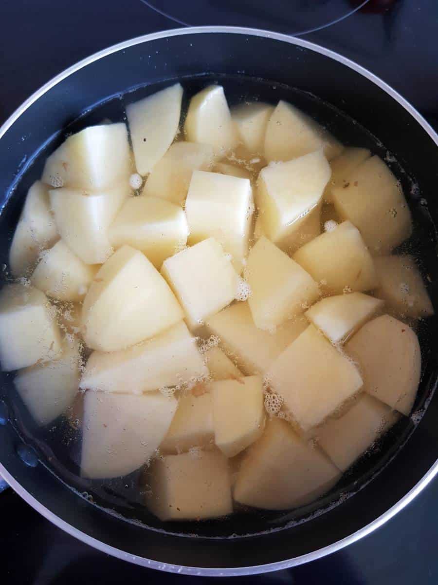 Boiling potatoes in a pot.