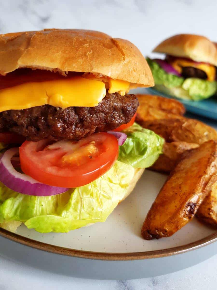 Hamburger made in air fryer on a plate.