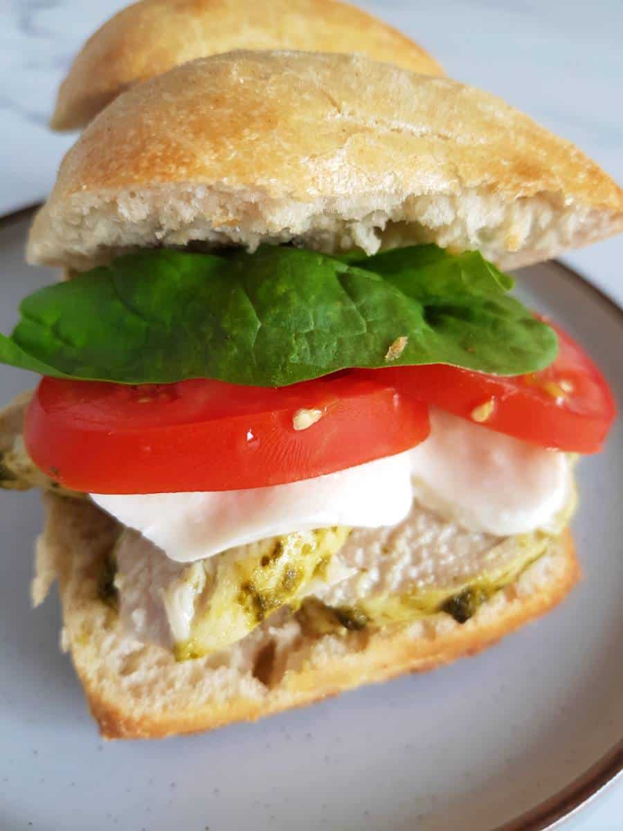 Mozzarella tomato pesto chicken sandwich.