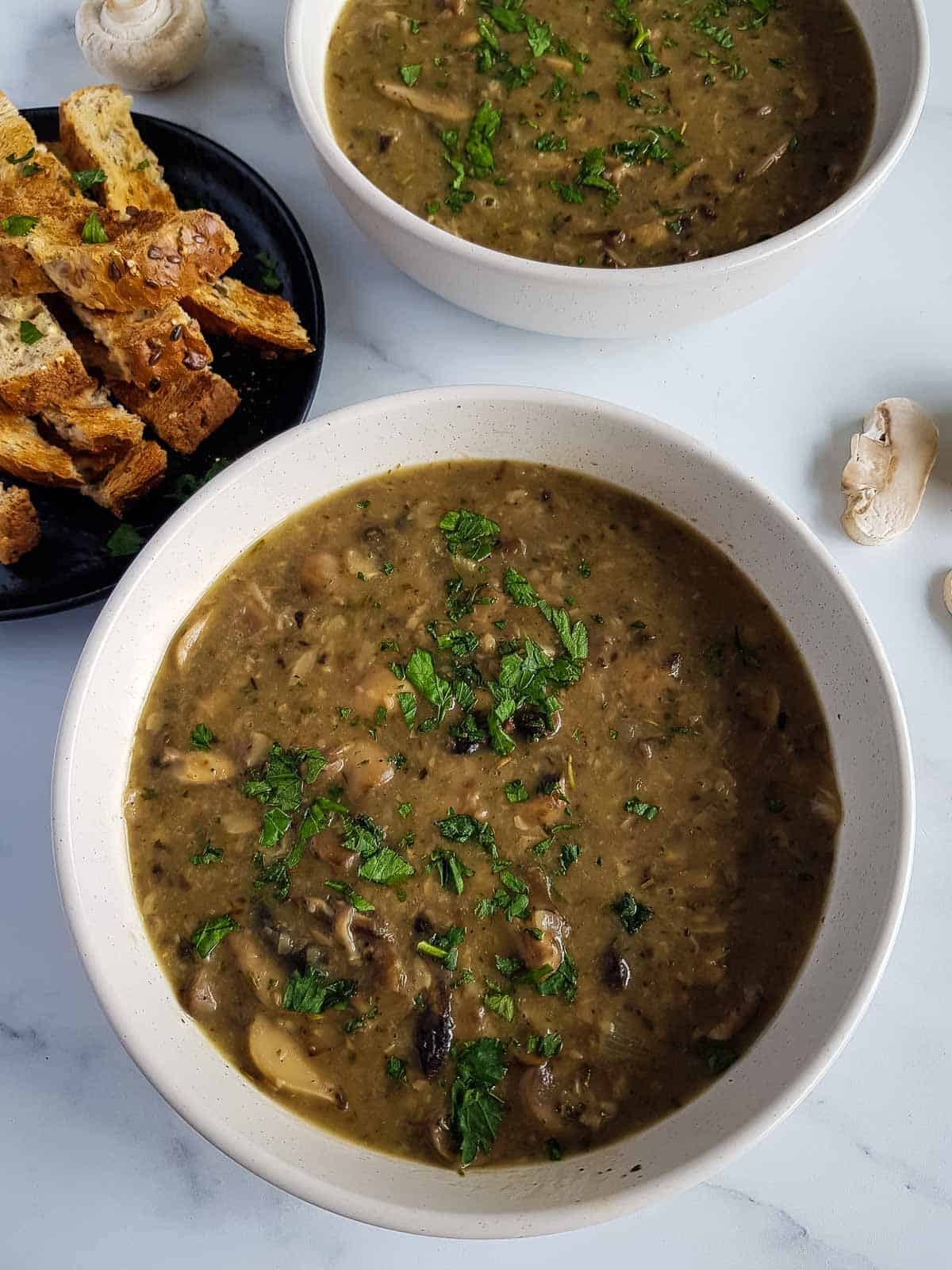 Dairy free mushroom soup with parsley.