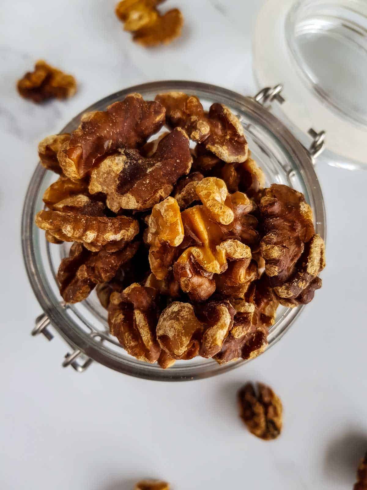 Roasted walnuts in a jar.