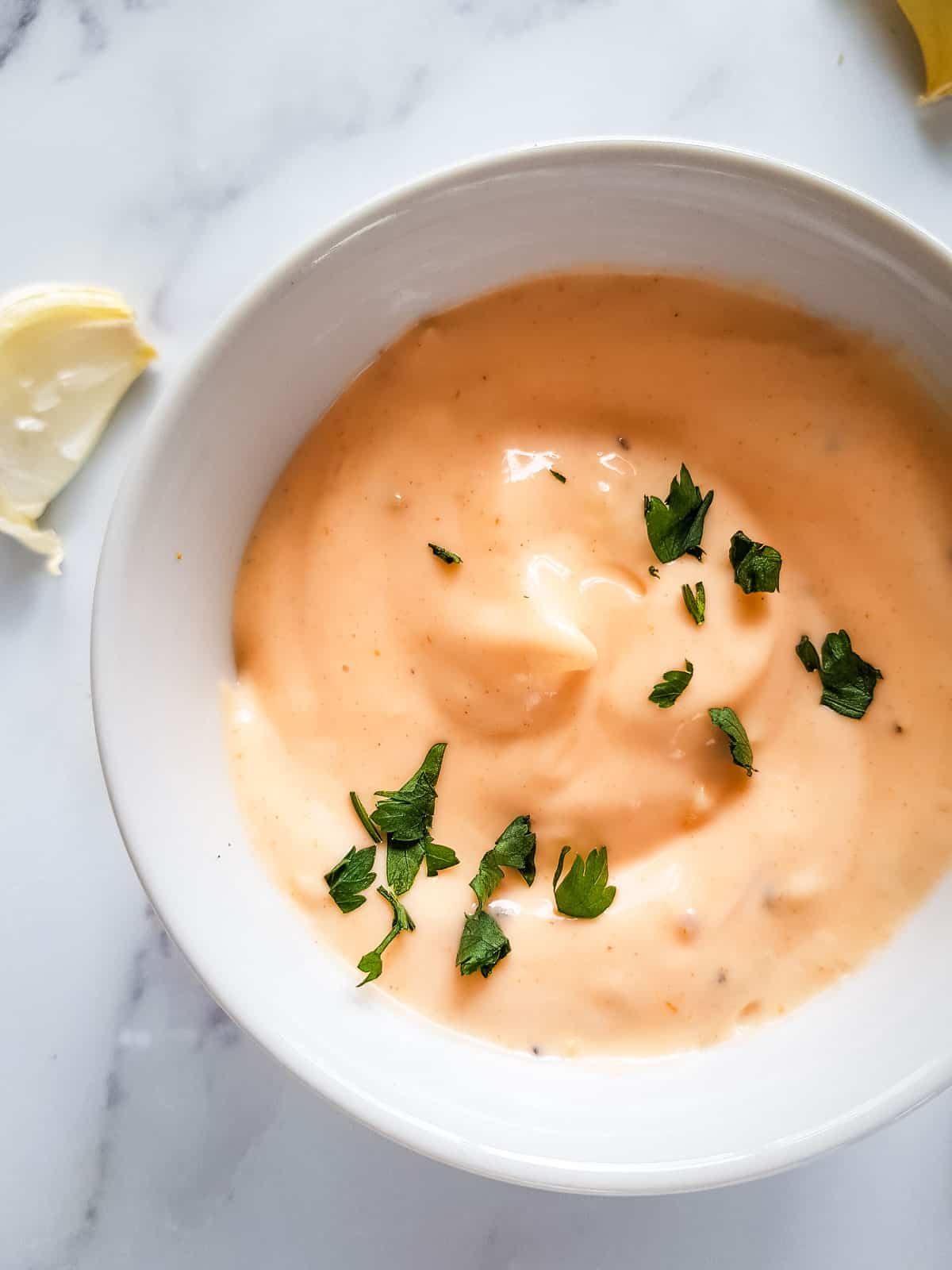 Sriracha aioli with parsley garnish.