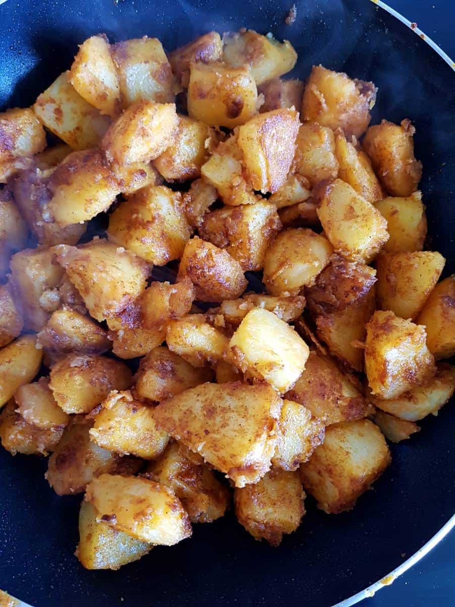 Taco potatoes in a skillet.