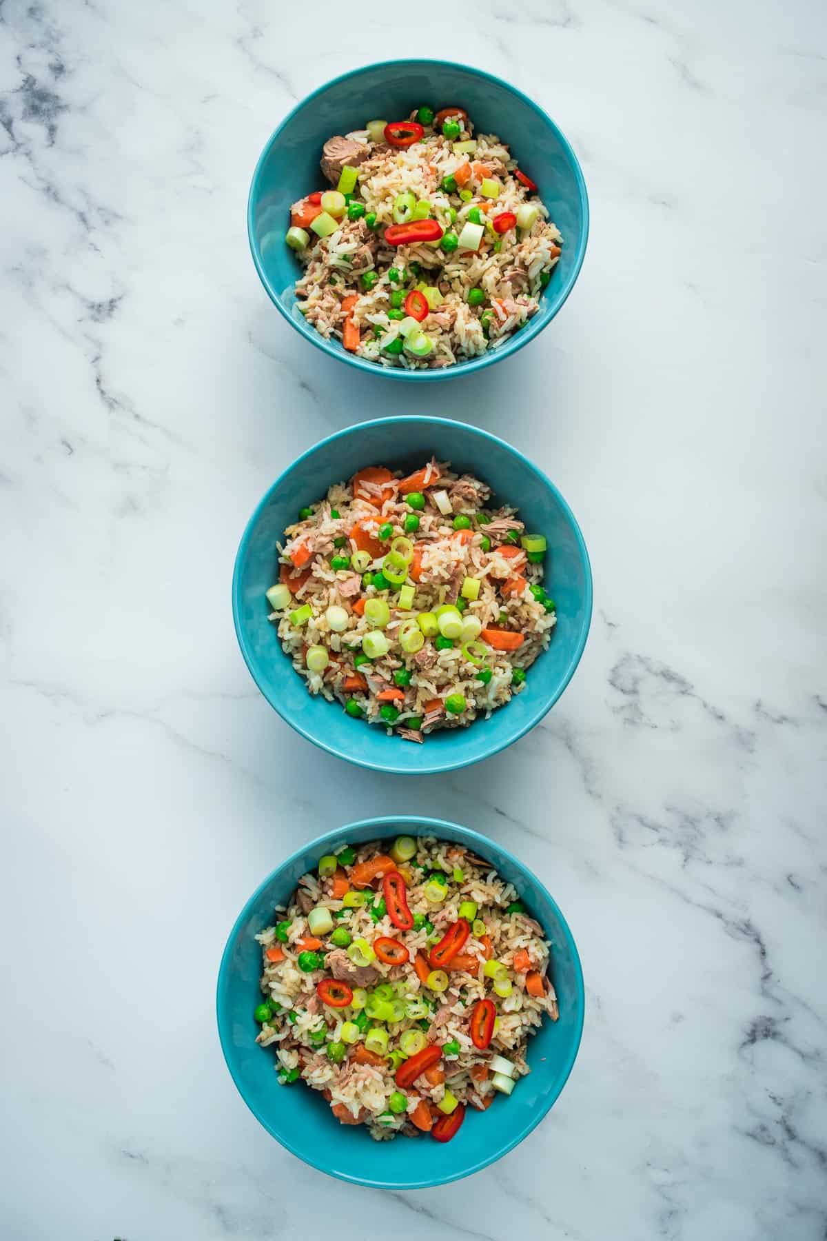 Three bowls of fried rice.