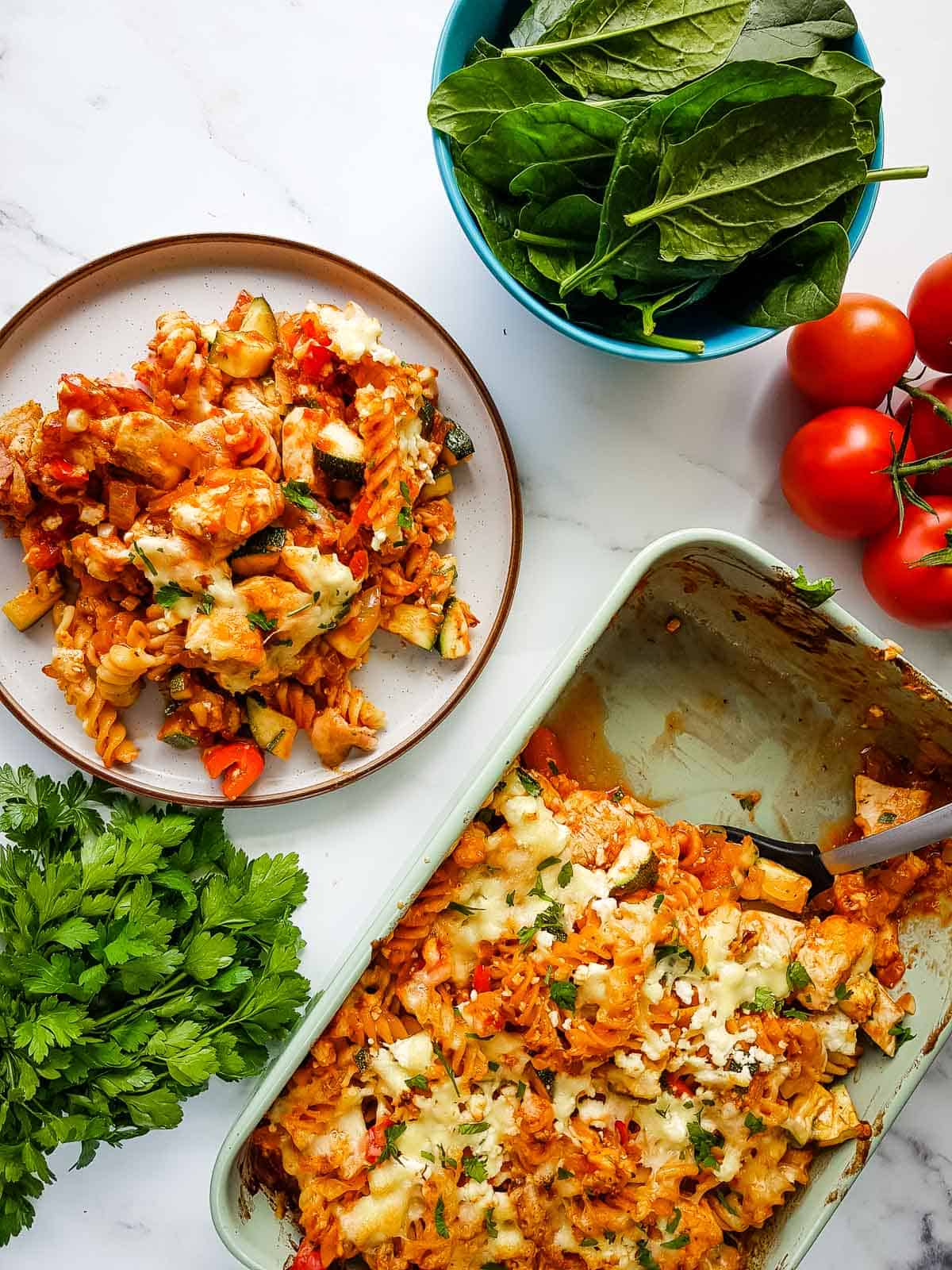 Pasta bake in a dish, with a plated portion on the side. 