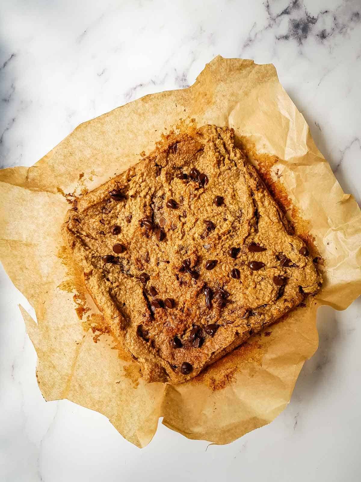 Chickpea blondie on parchment paper.