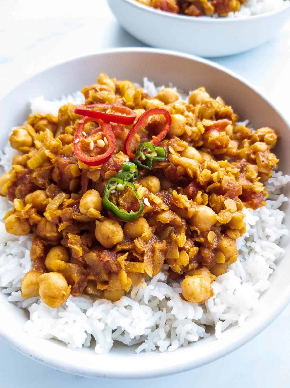 Chickpea lentil curry in a plate with rice.