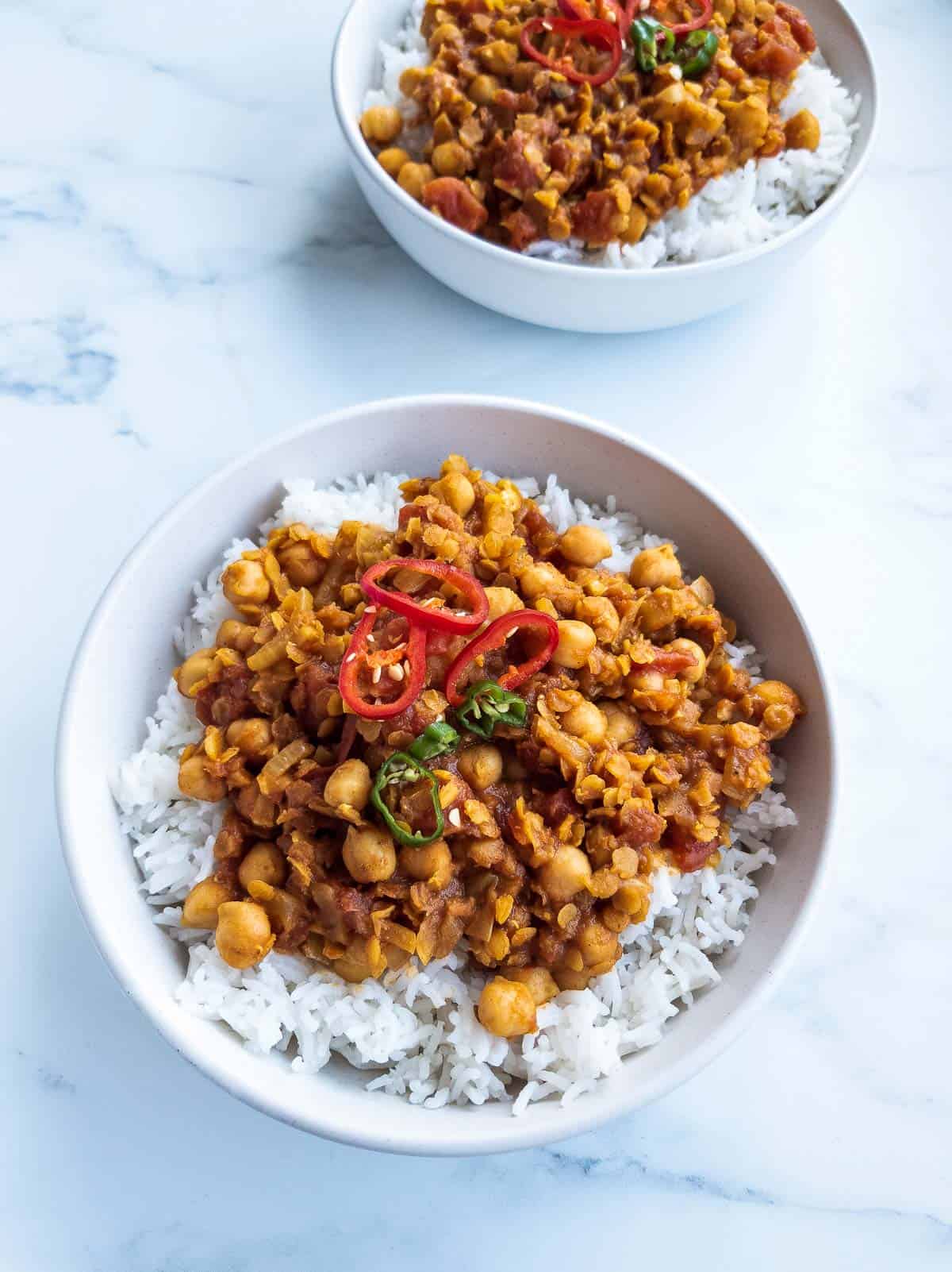 Vegan lentil curry in a bowl with rice.