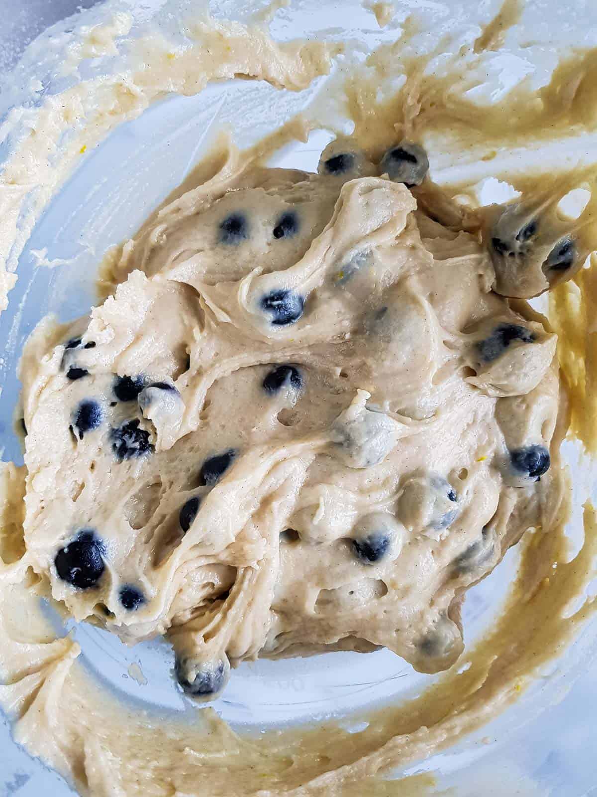 Blueberries added to the muffin batter.