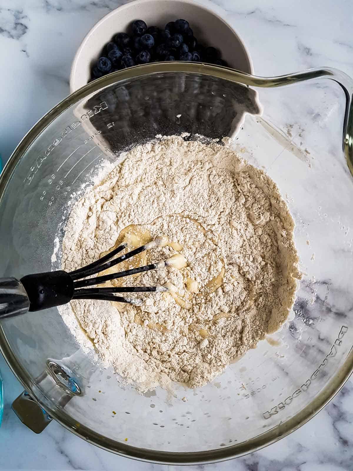 Dry ingredients added to the mixing bowl with the wet.