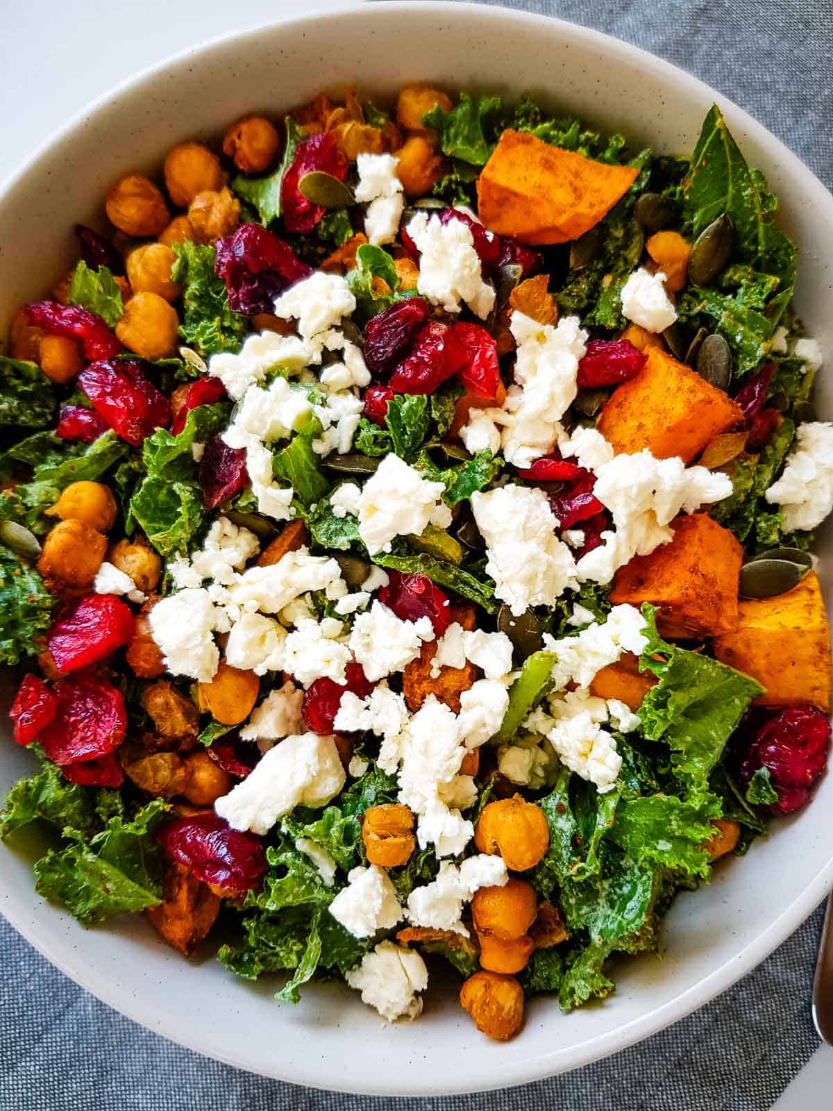 Kale and cranberry salad with feta cheese and chickpeas.