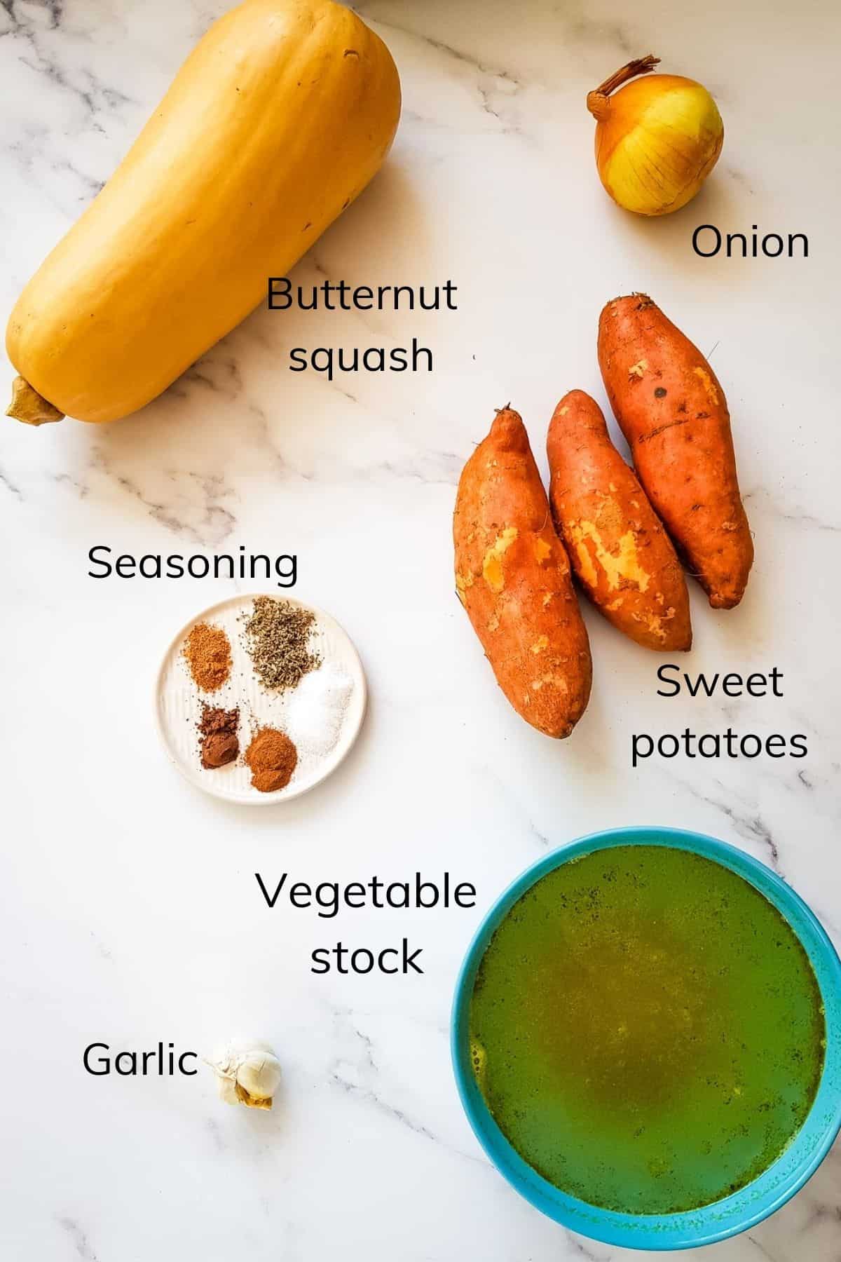 Pumpkin and Sweet Potato Soup ingredients laid out on a table.