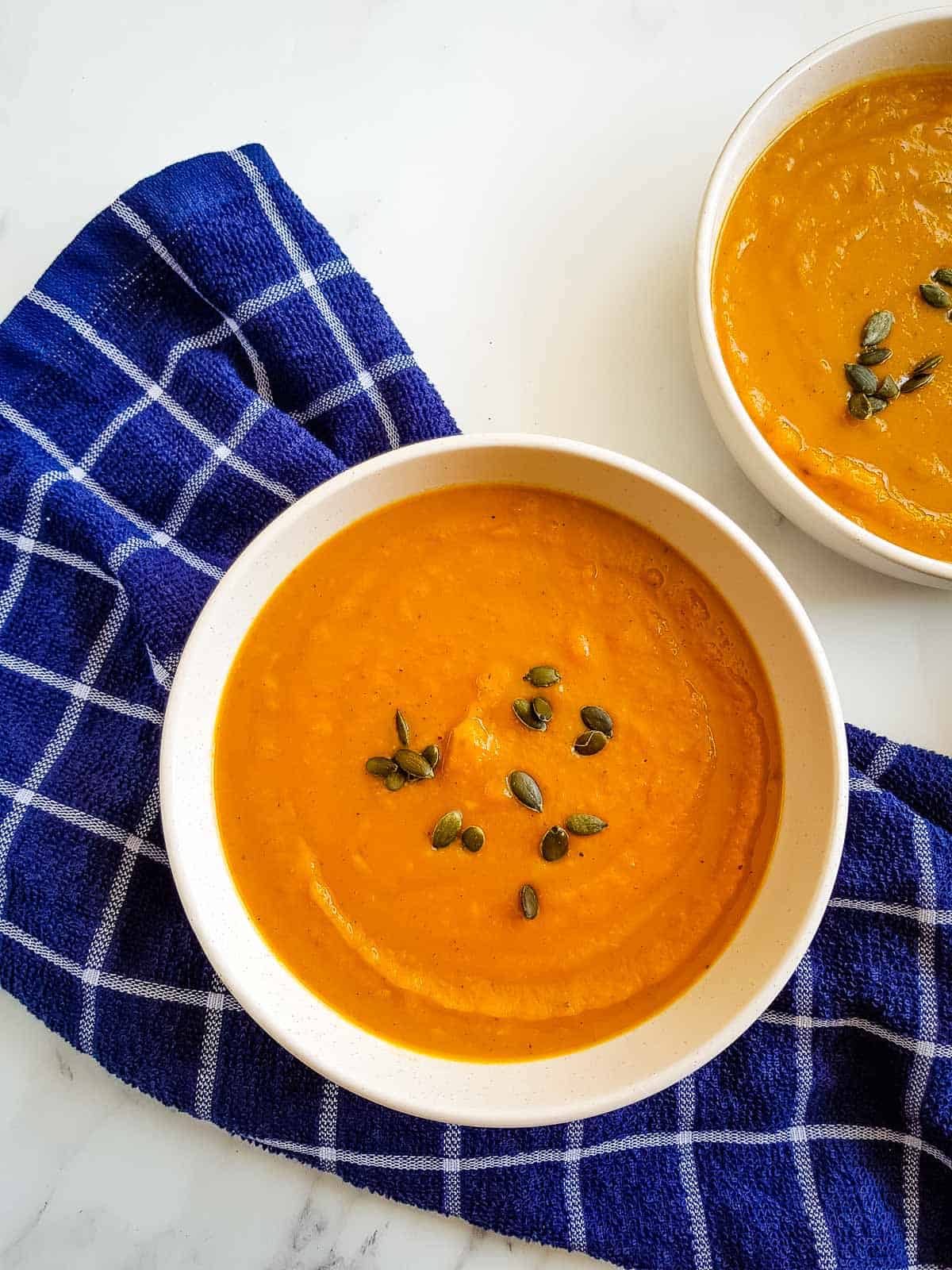 Sweet potato and butternut squash soup in a bowl.