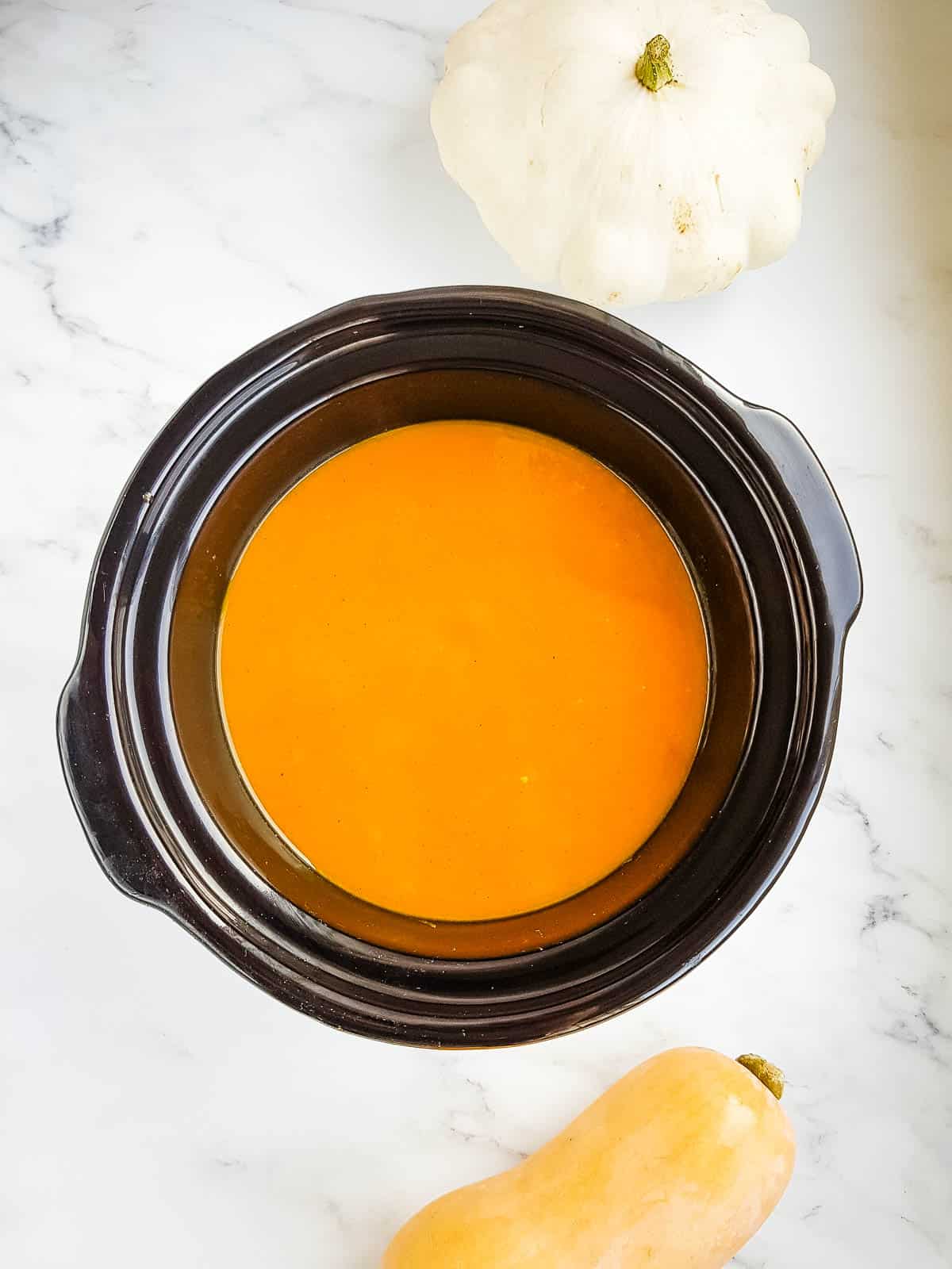 Pumpkin soup in a slow cooker.