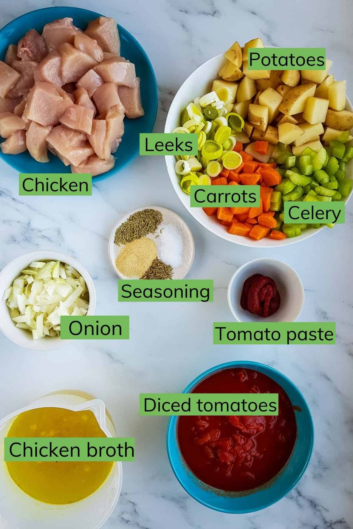 Ingredients for slow cooker chicken stew laid out on a table.