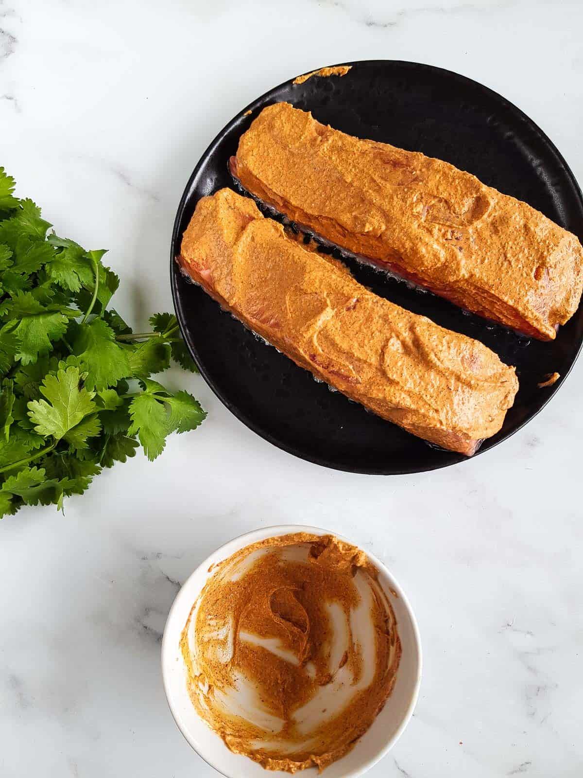 Marinated salmon on a plate.