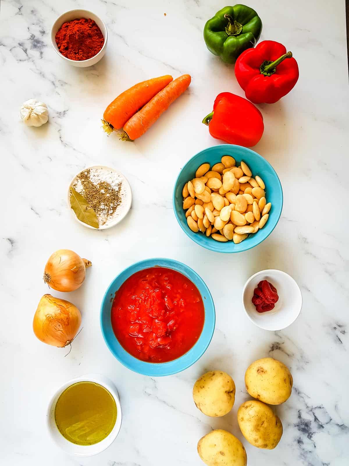 The ingredients for vegetable goulash laid out on a table.