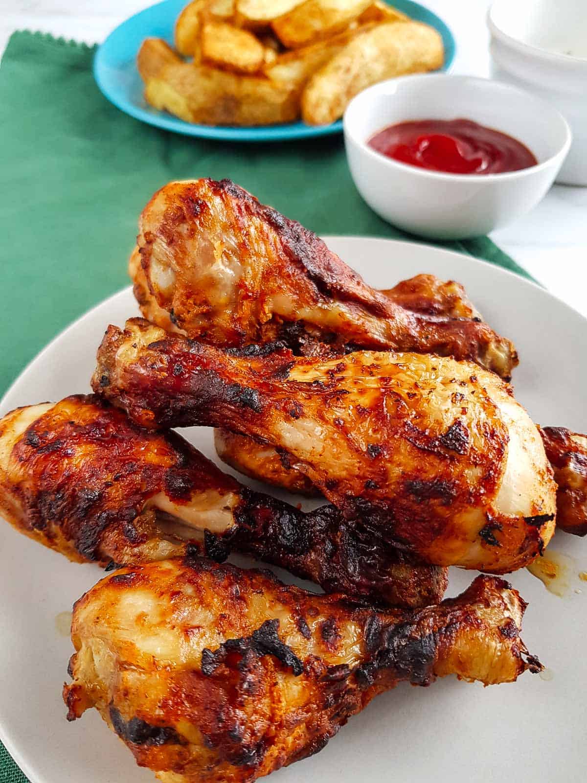 Close up of air fryer drumsticks.