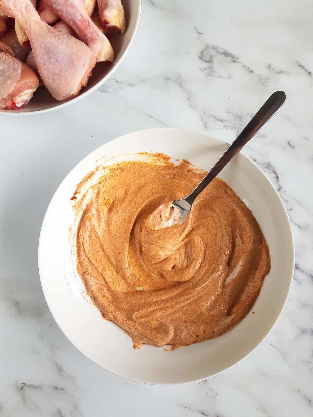 Greek yogurt chicken marinade in a bowl.