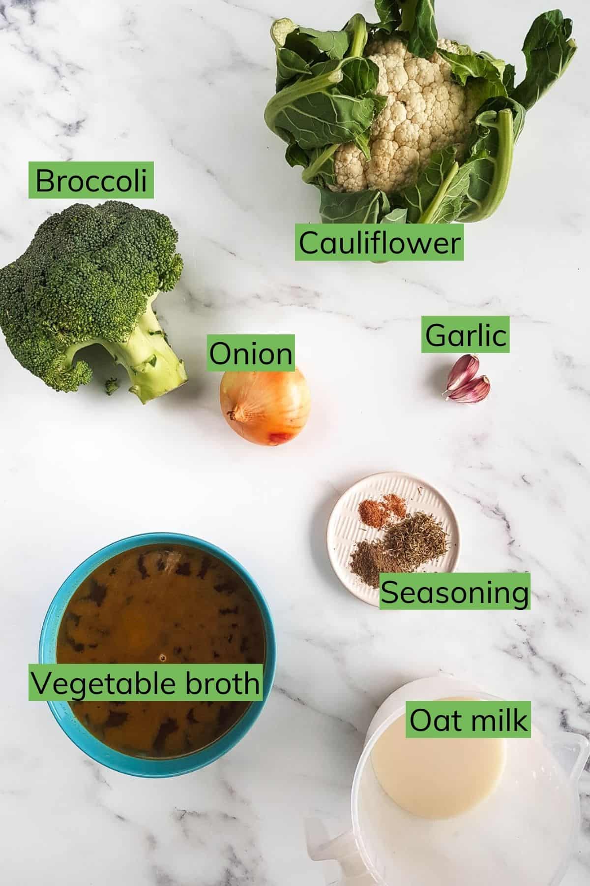 Ingredients required to make broccoli and cauliflower soup laid out on a table.