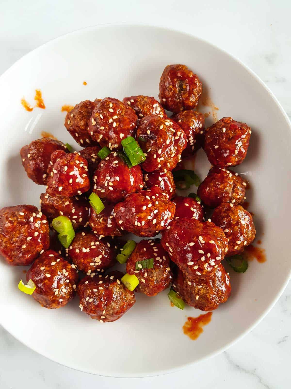 Honey sriracha glazed meatballs in a bowl.