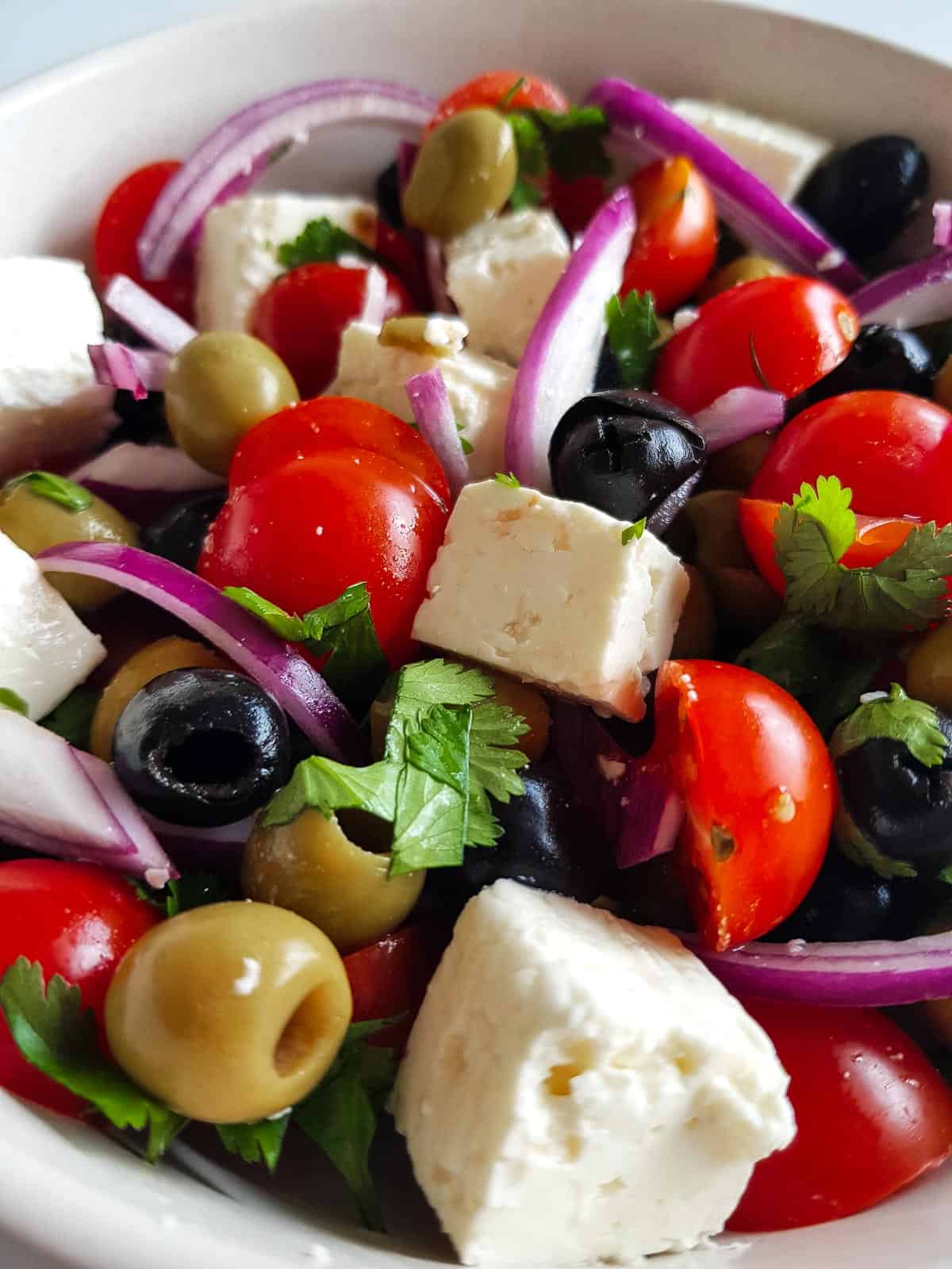 Mixed olive salad with feta and tomatoes.