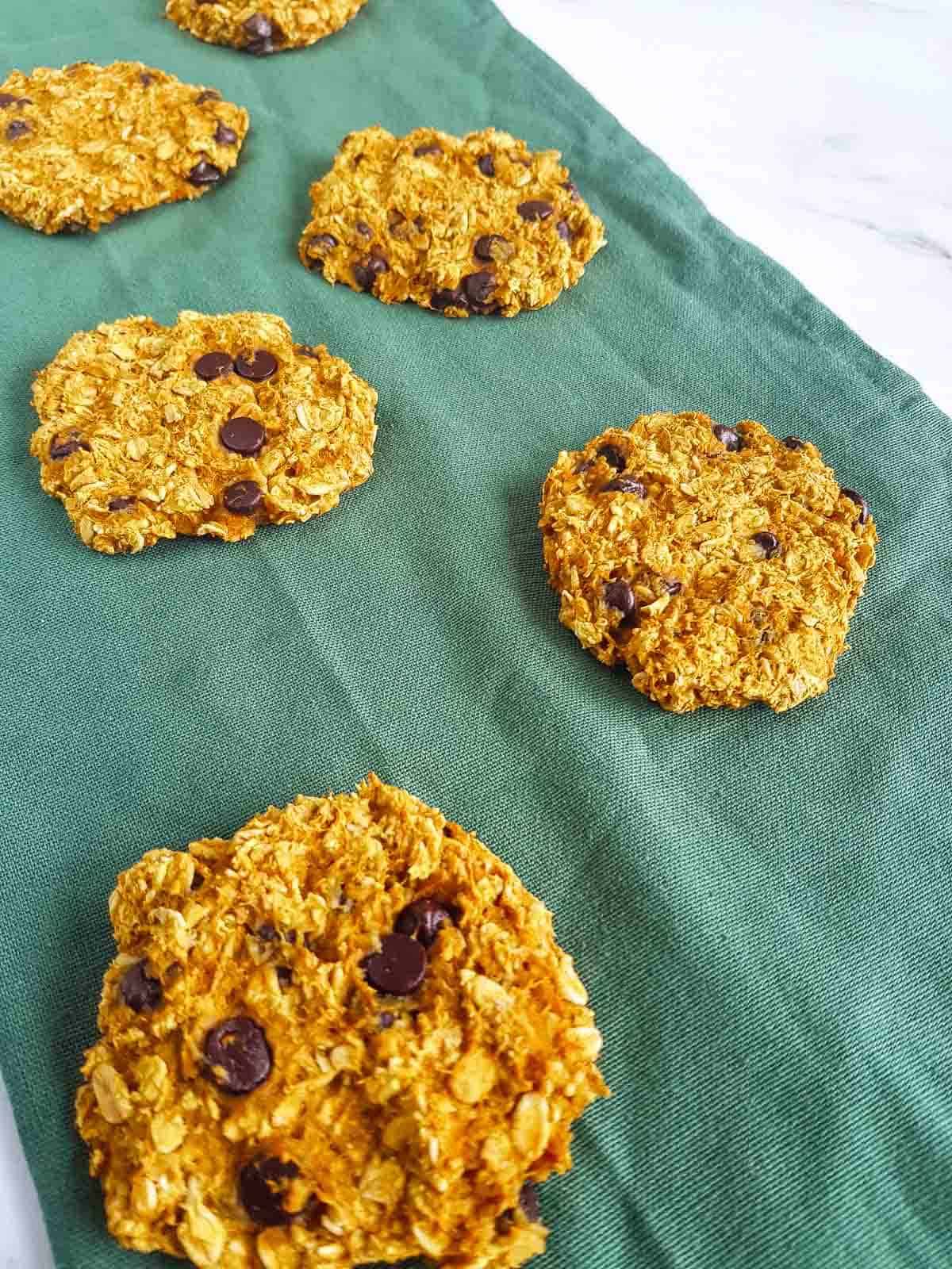 Chocolate chip pumpkin cookies on a napkin.