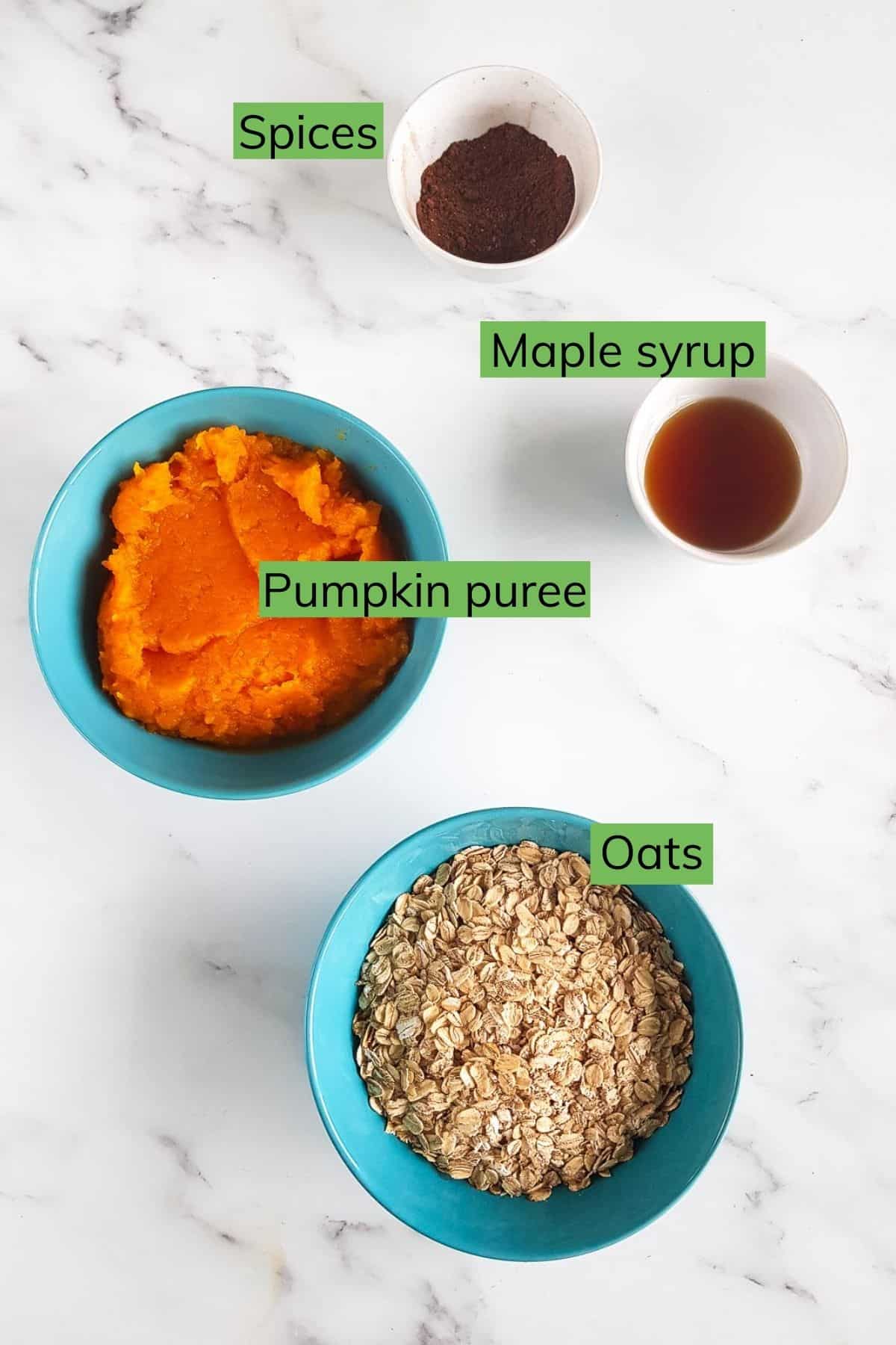 Ingredients for pumpkin oatmeal cookies laid out on a table.