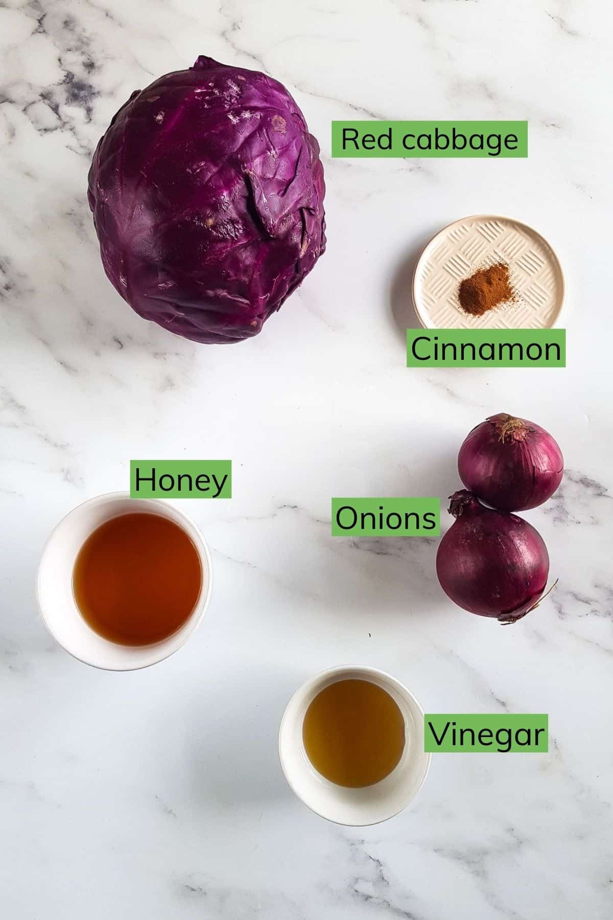 The ingredients needed to make the red cabbage laid out on a table.