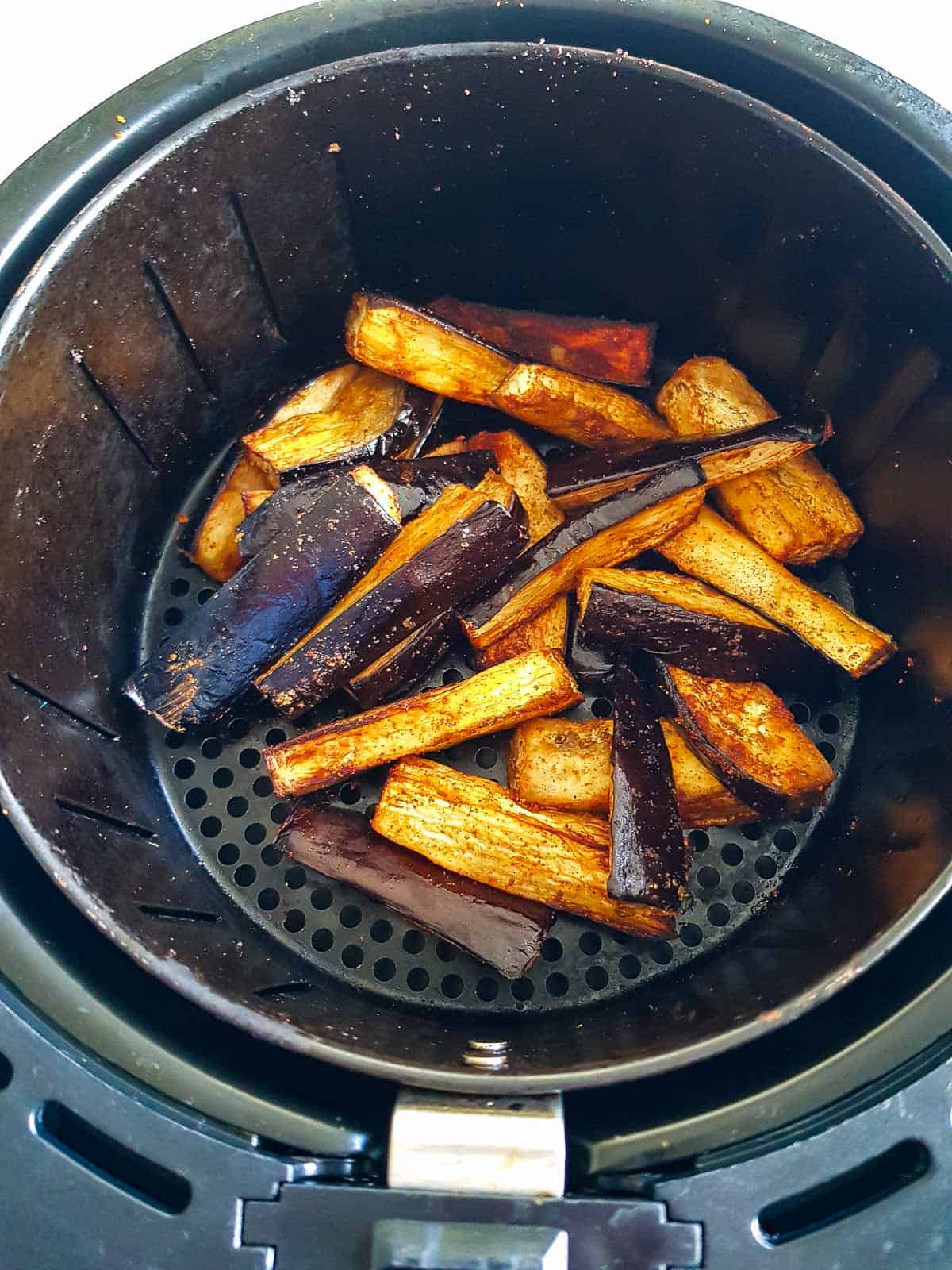 Air fried eggplant in an air fryer.