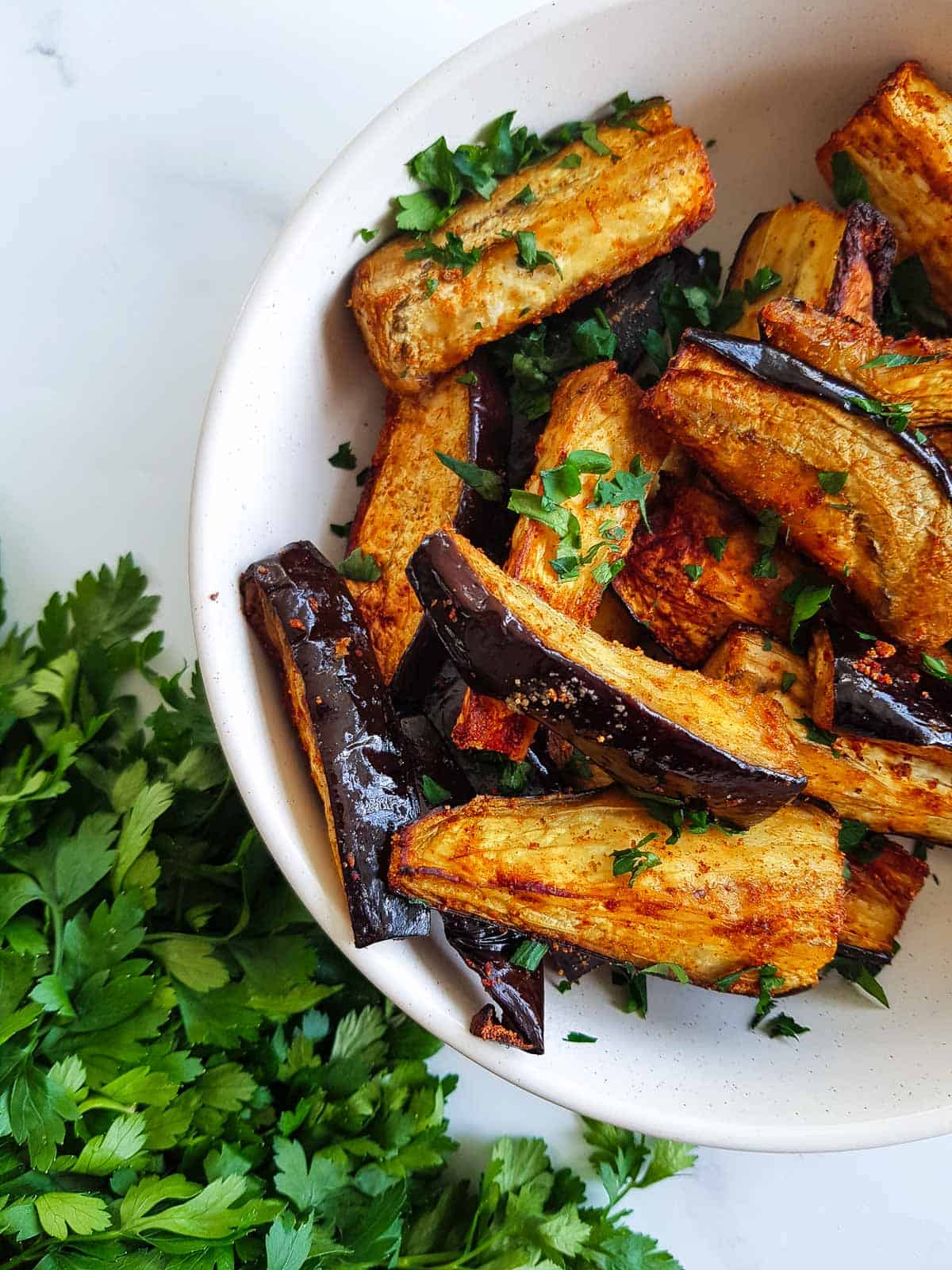 Air fryer eggplant fries in a bowl.