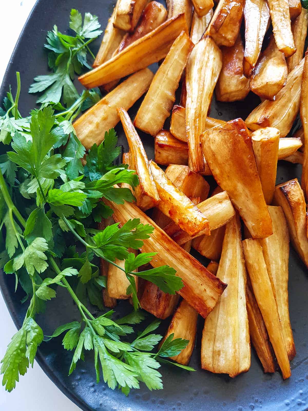 Cooked parsnip side dish on a platter.