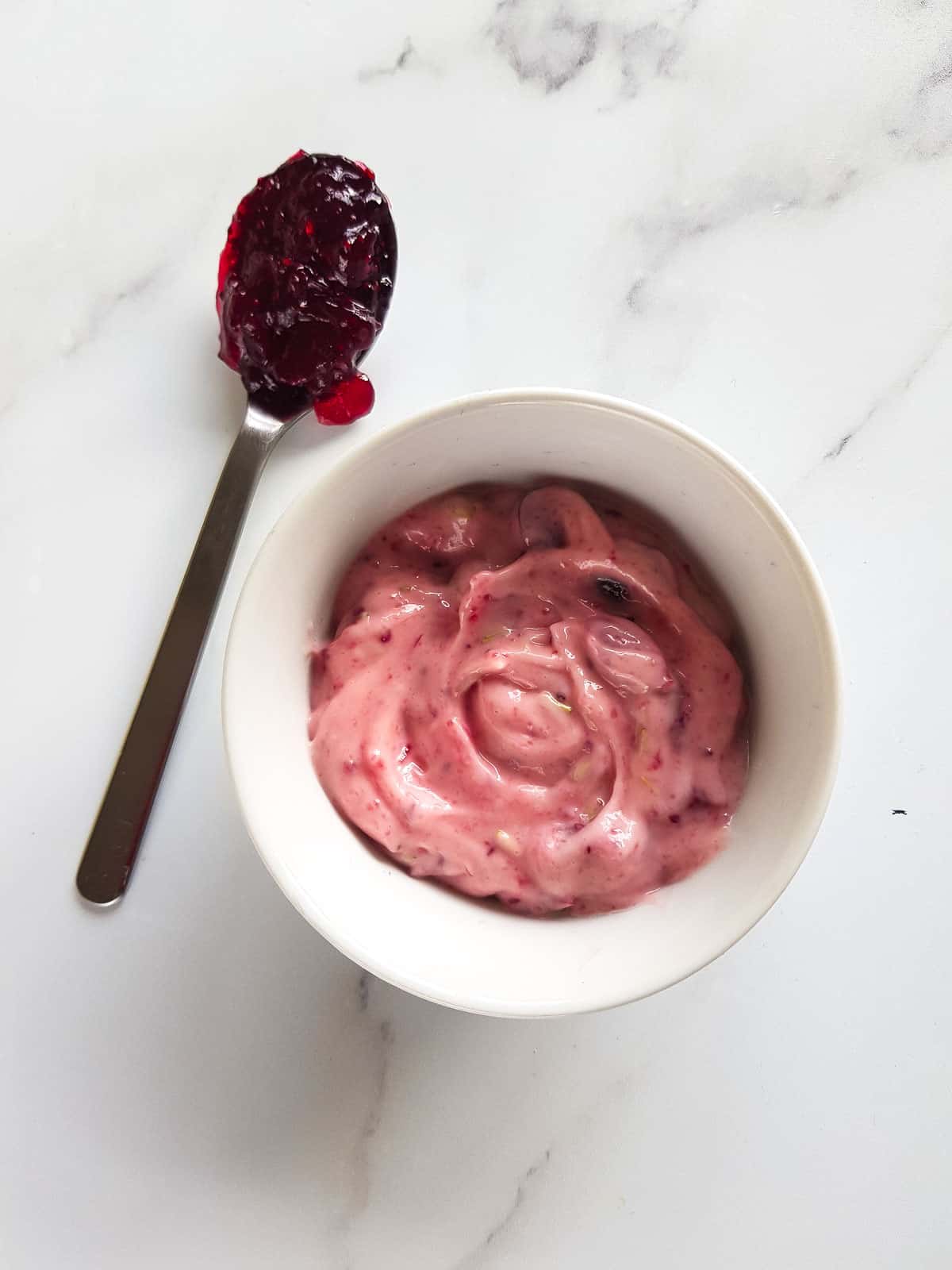 Aioli with cranberry sauce in a bowl.