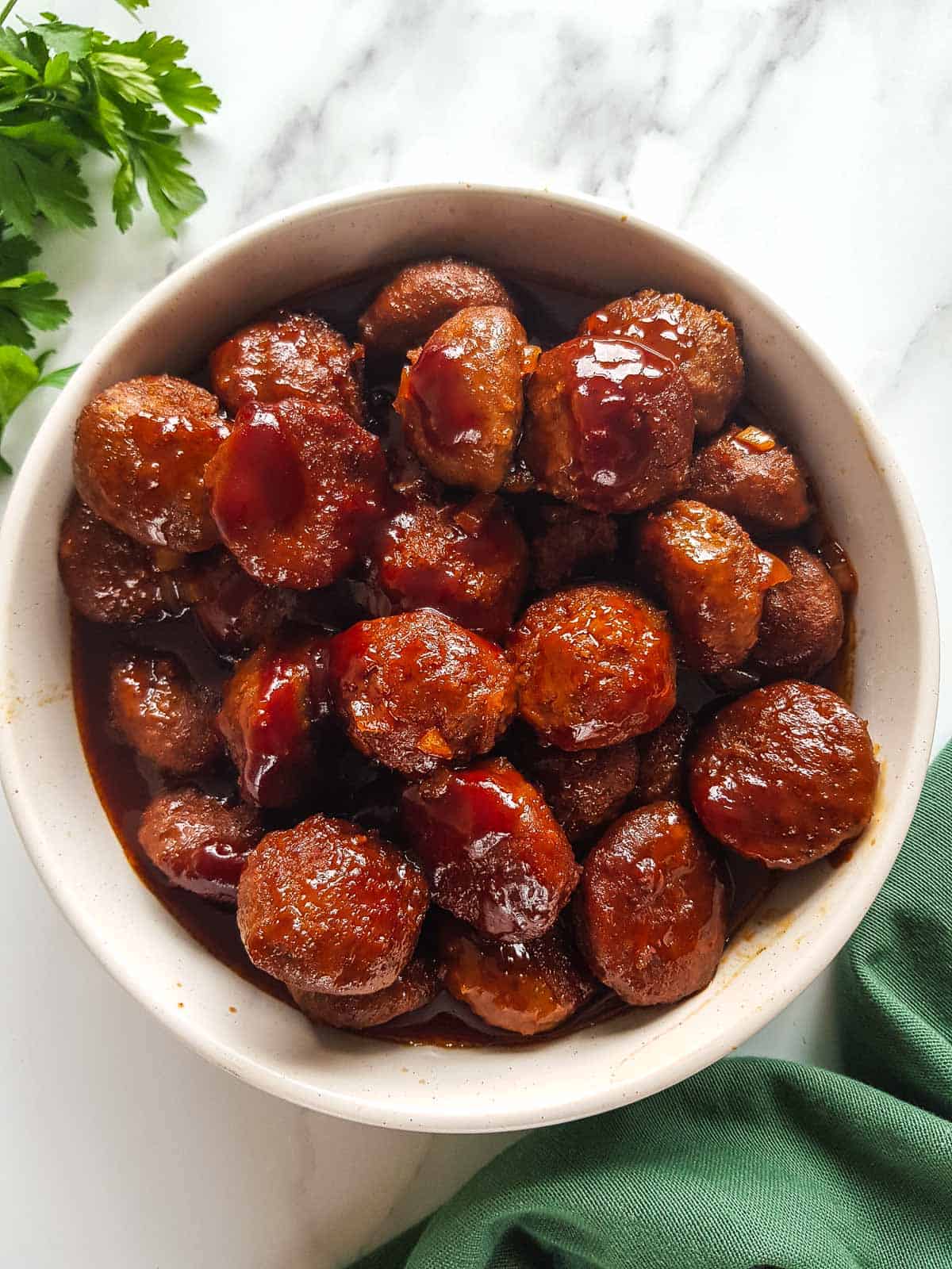 A bowl of BBQ sauce meatballs.