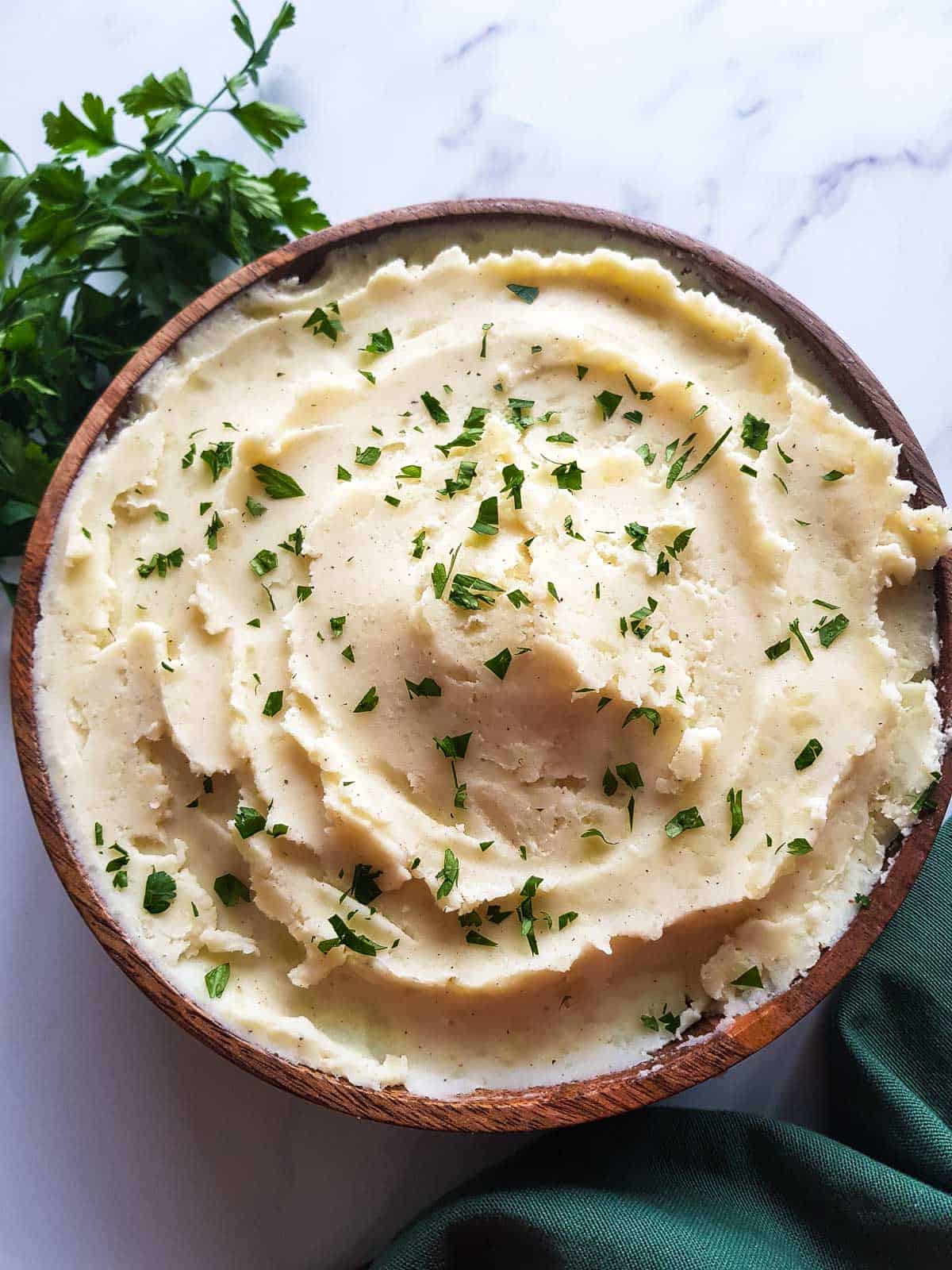 Mashed potatoes garnished with parsley.