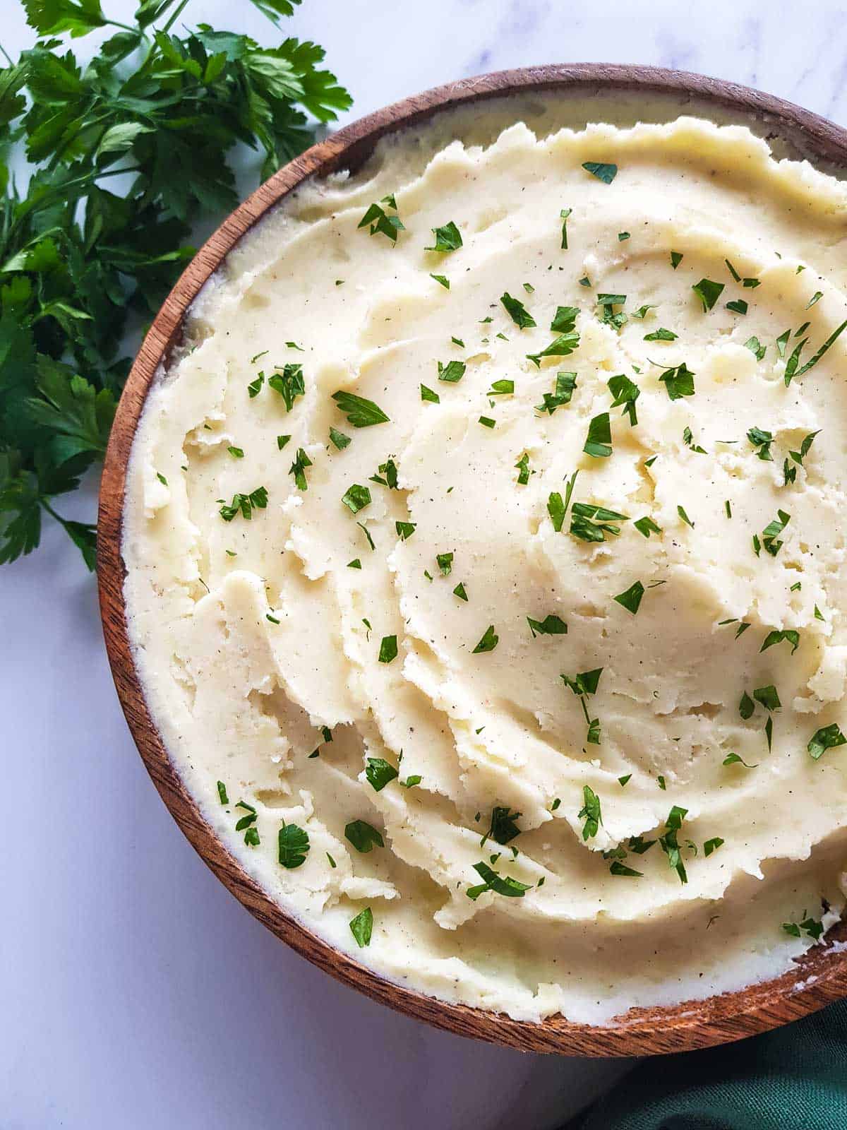 A bowl of mashed potatoes with Greek yogurt.