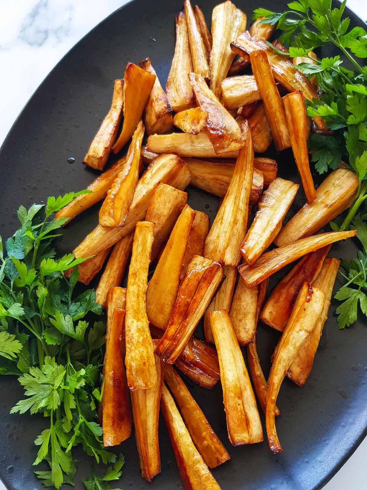 Close up of honey glazed parsnips.