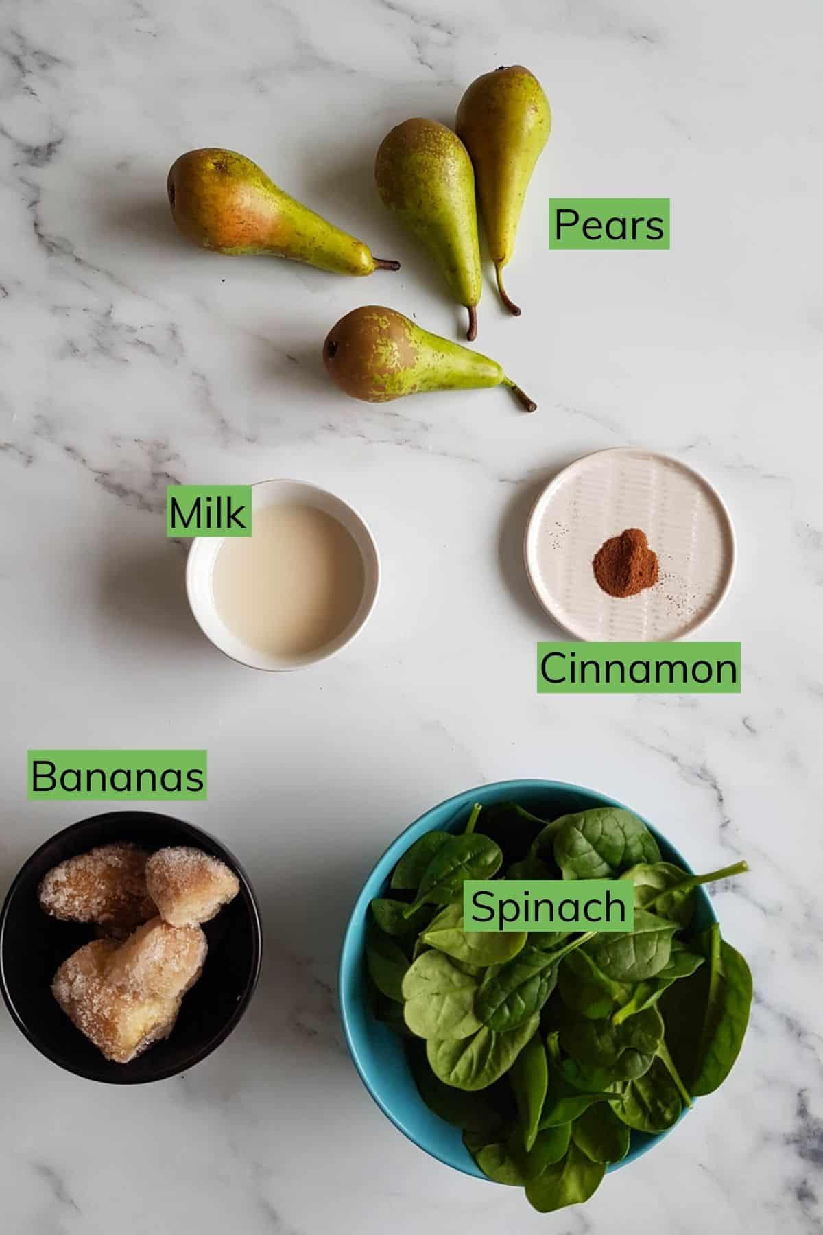 The ingredients required to make pear smoothie laid out on a table.