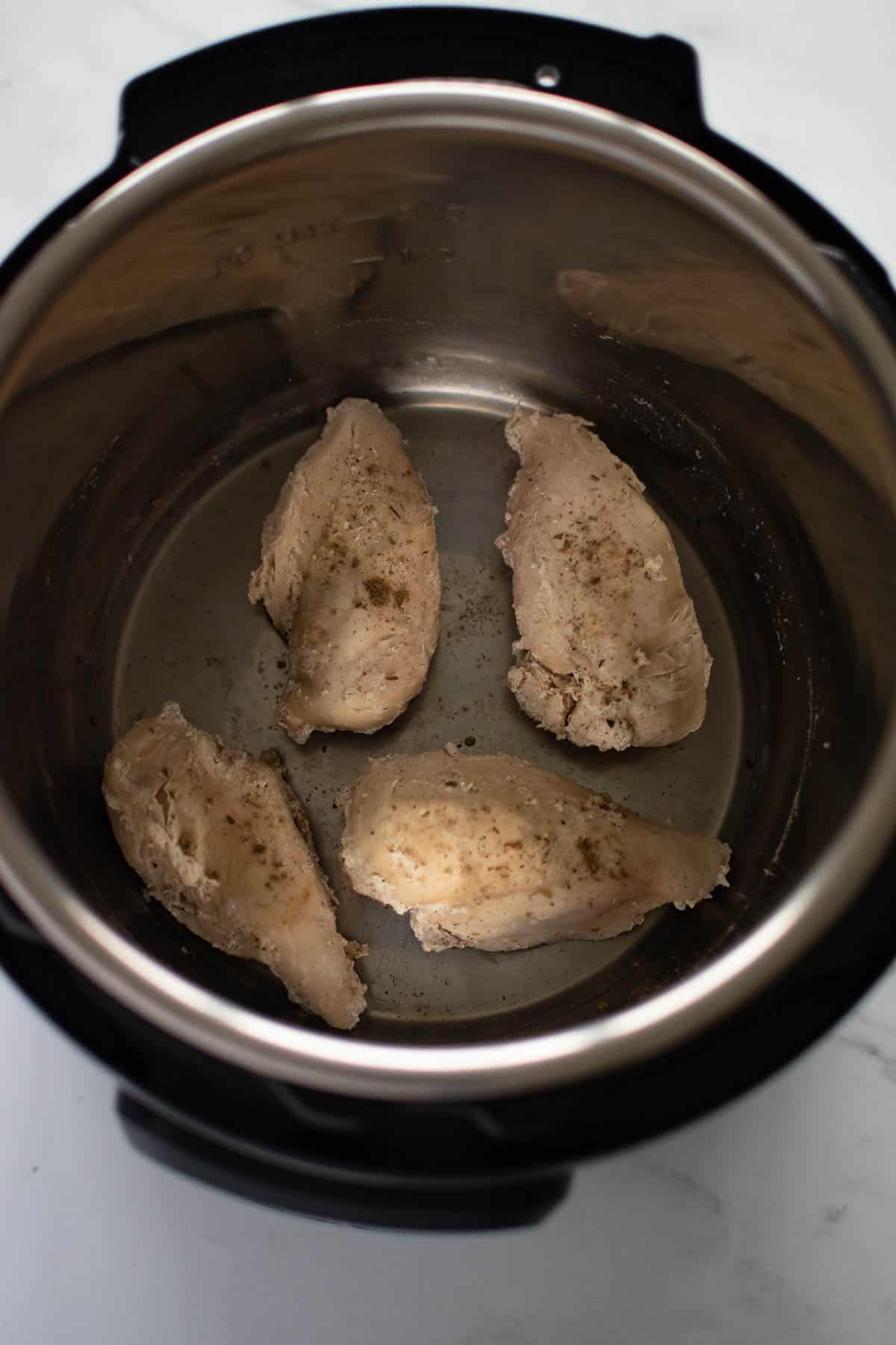 Cooked chicken breasts in an instant pot.