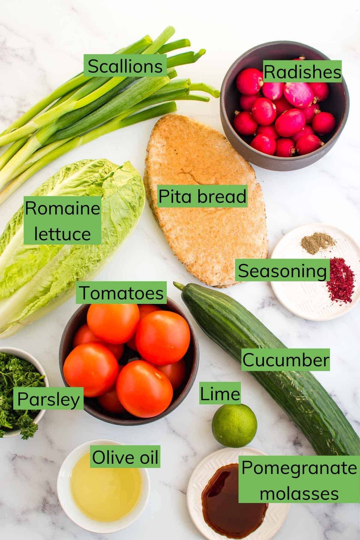 Ingredients needed to make Lebanese salad laid out on a table.