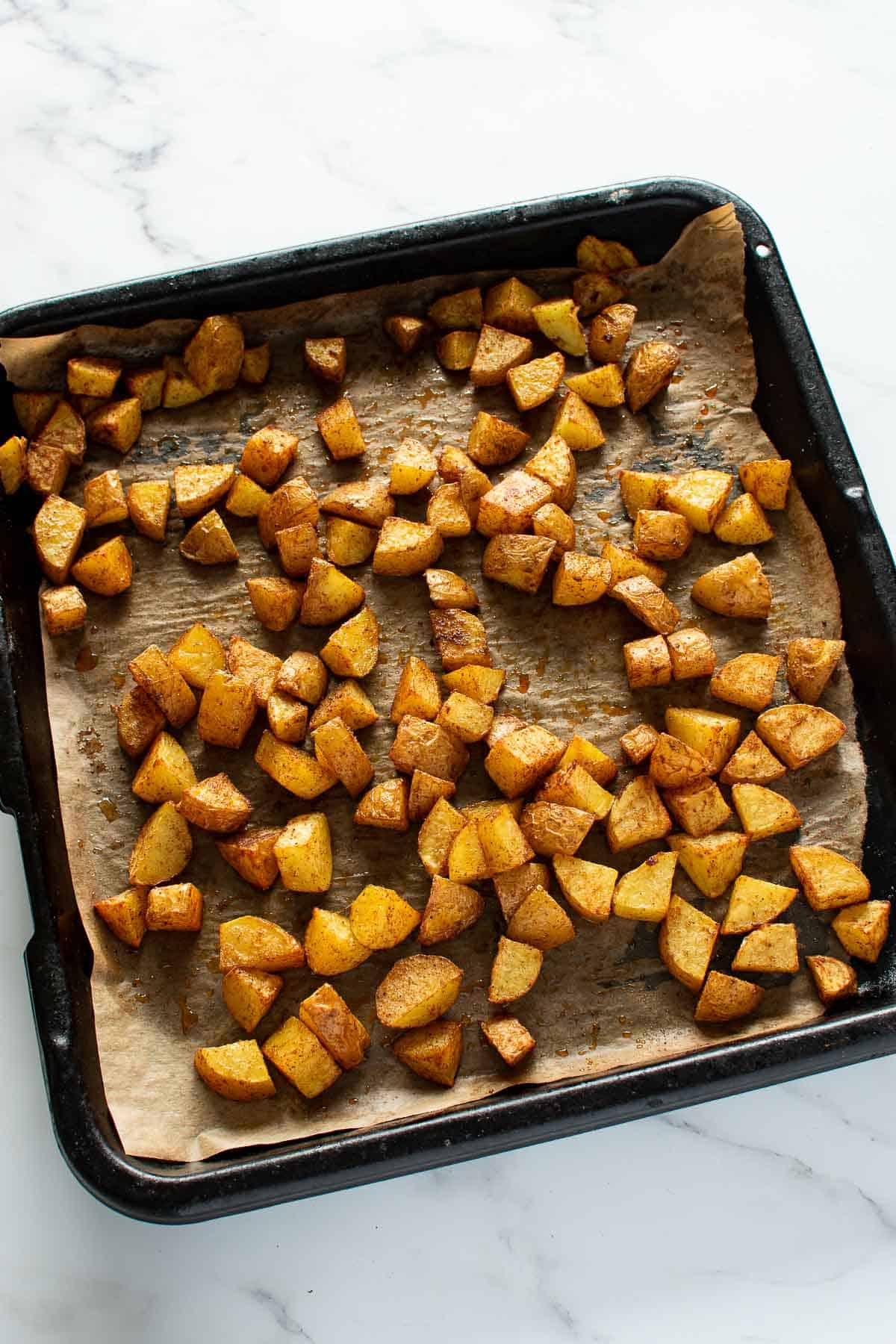 A sheet pan with roast Mexican potatoes.