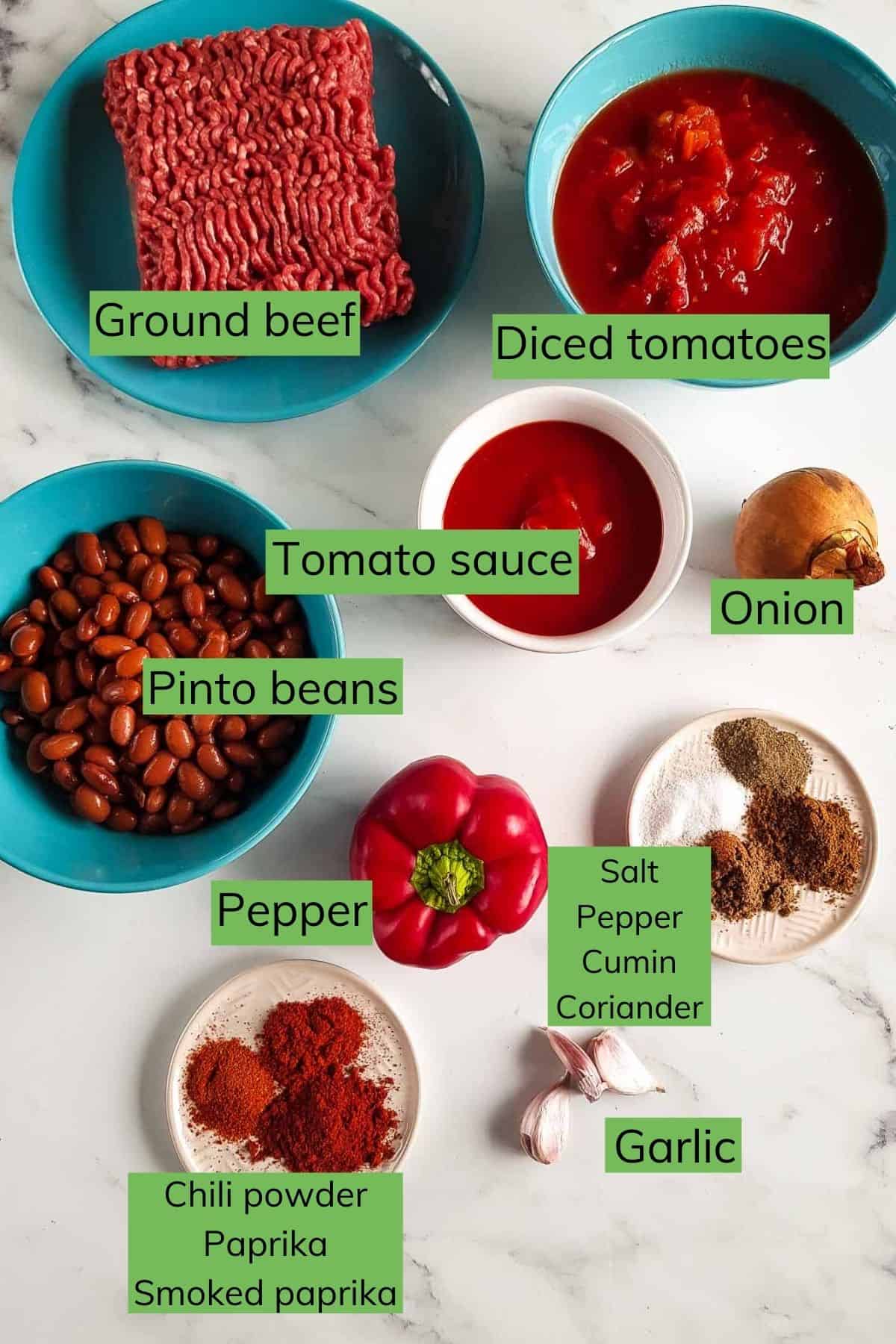 Ingredients for slow cooker chilli con carne laid out on a table.