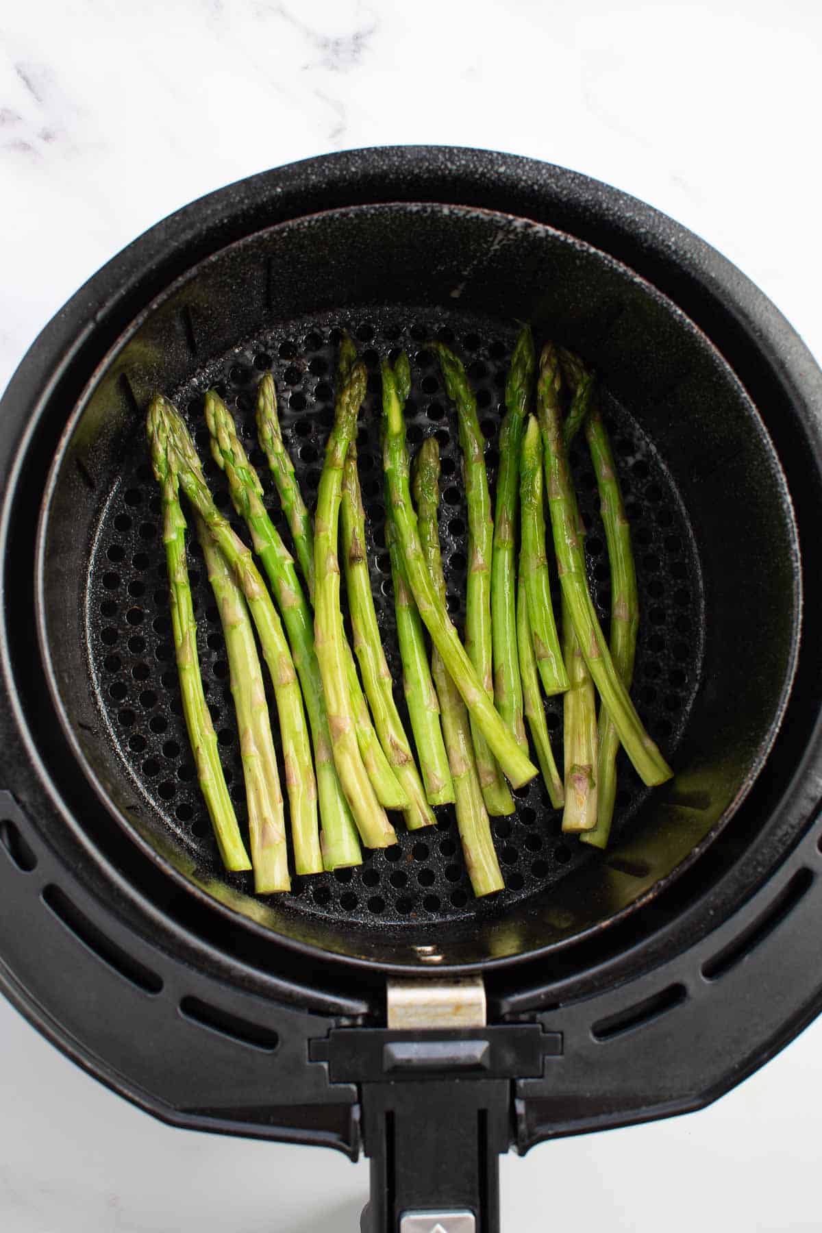 Asparagus in an air fryer.