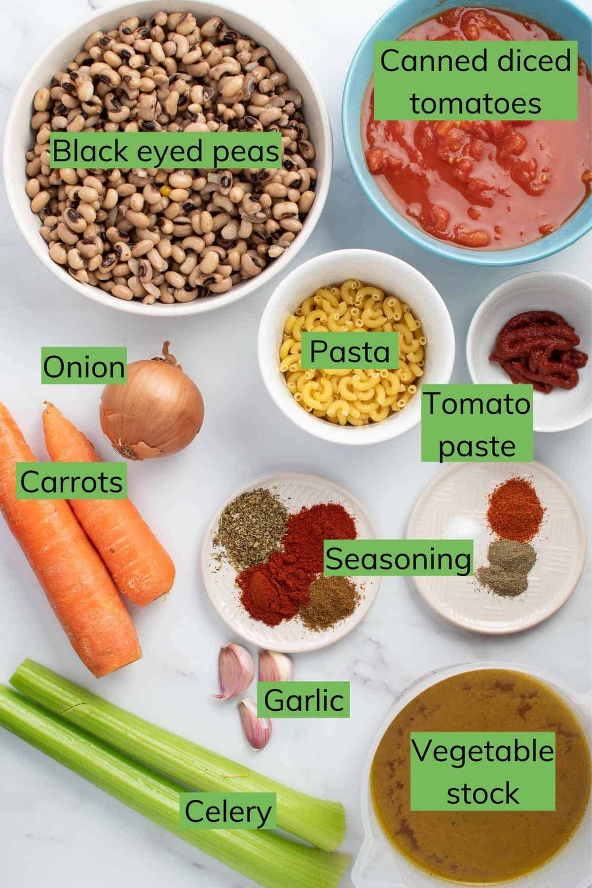 The ingredients required to make the soup laid out on a table.