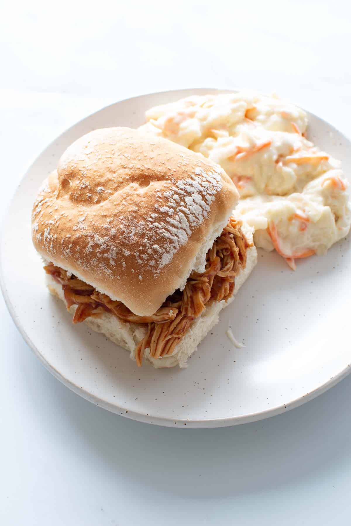 Pulled BBQ chicken sandwich with coleslaw.