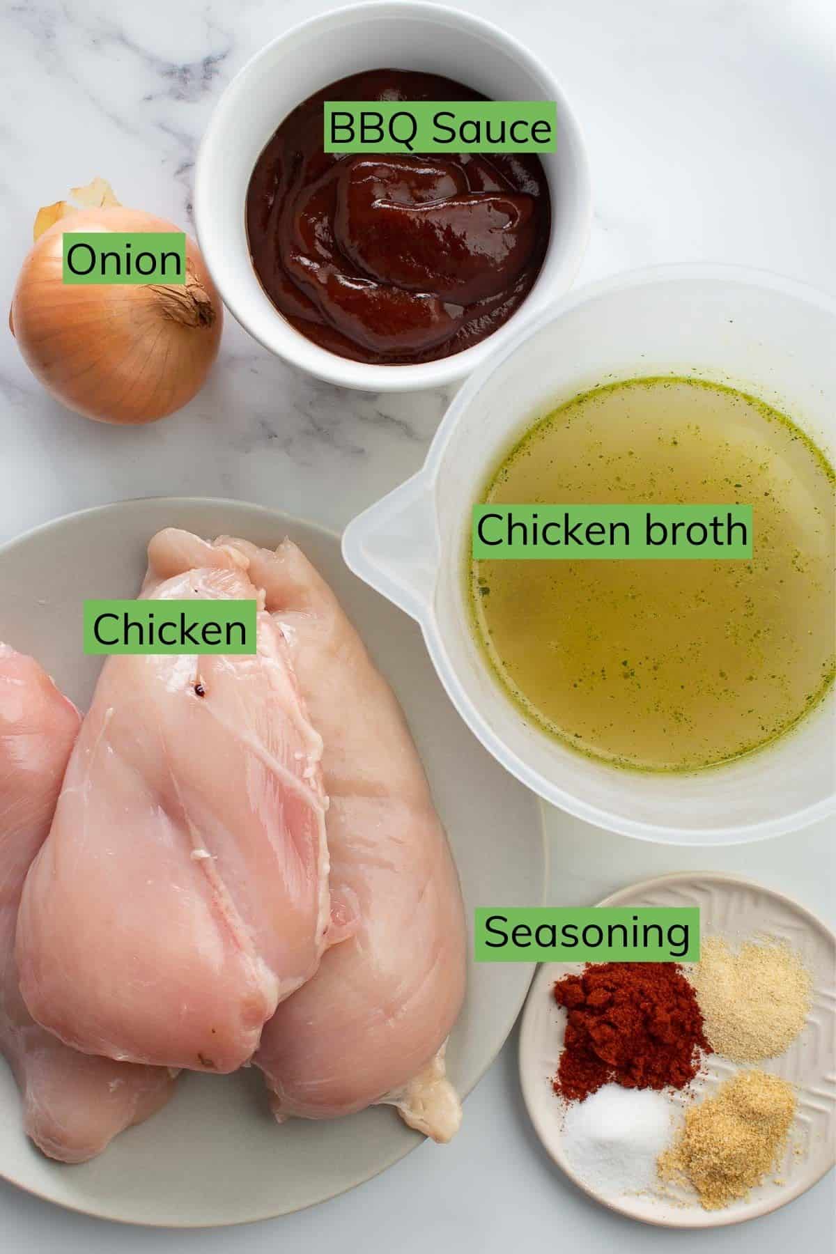 The ingredients required to make instant pot BBQ chicken laid out on a table.