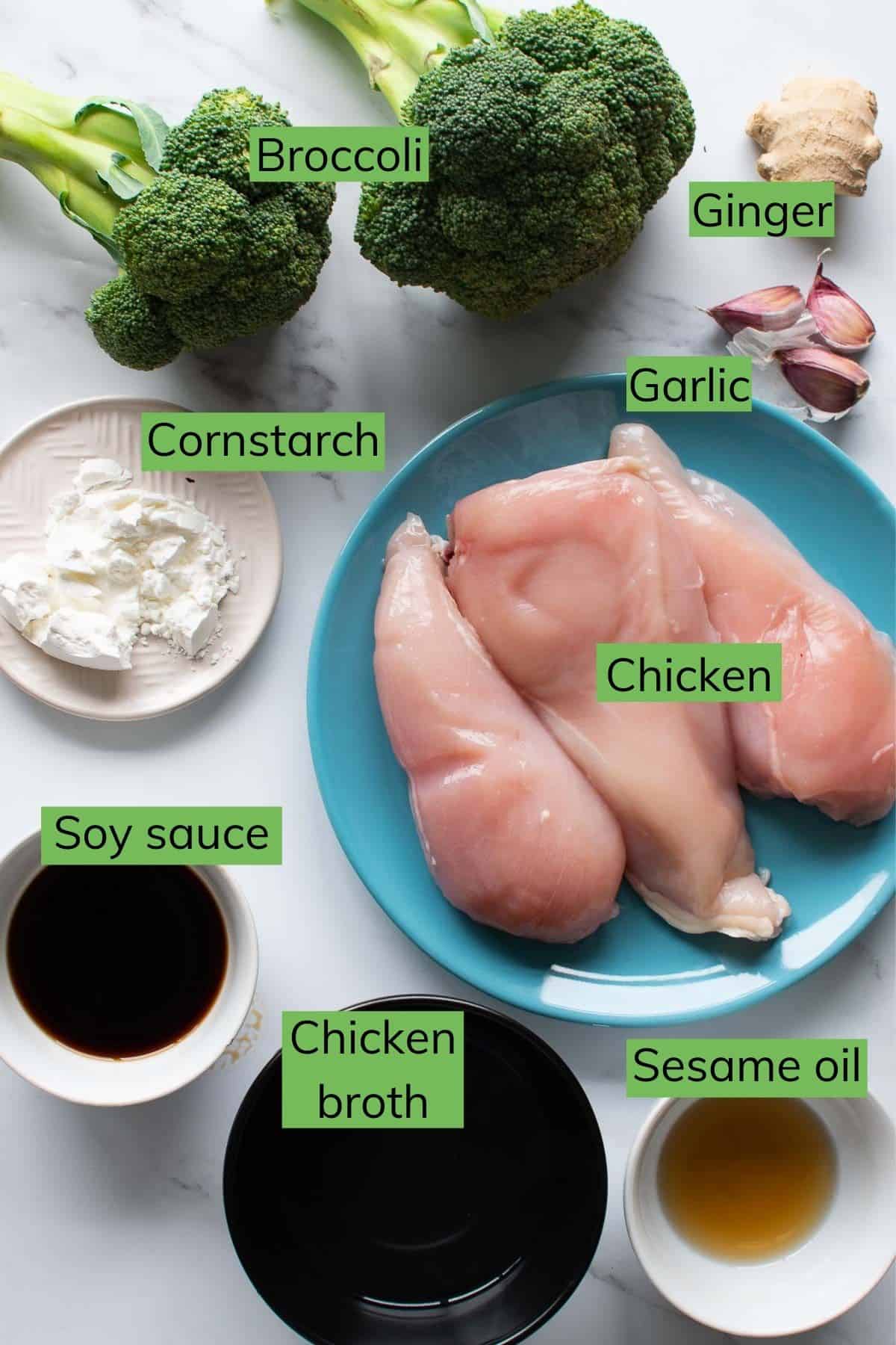 The ingredients needed to make instant pot chicken and broccoli laid out on a table.