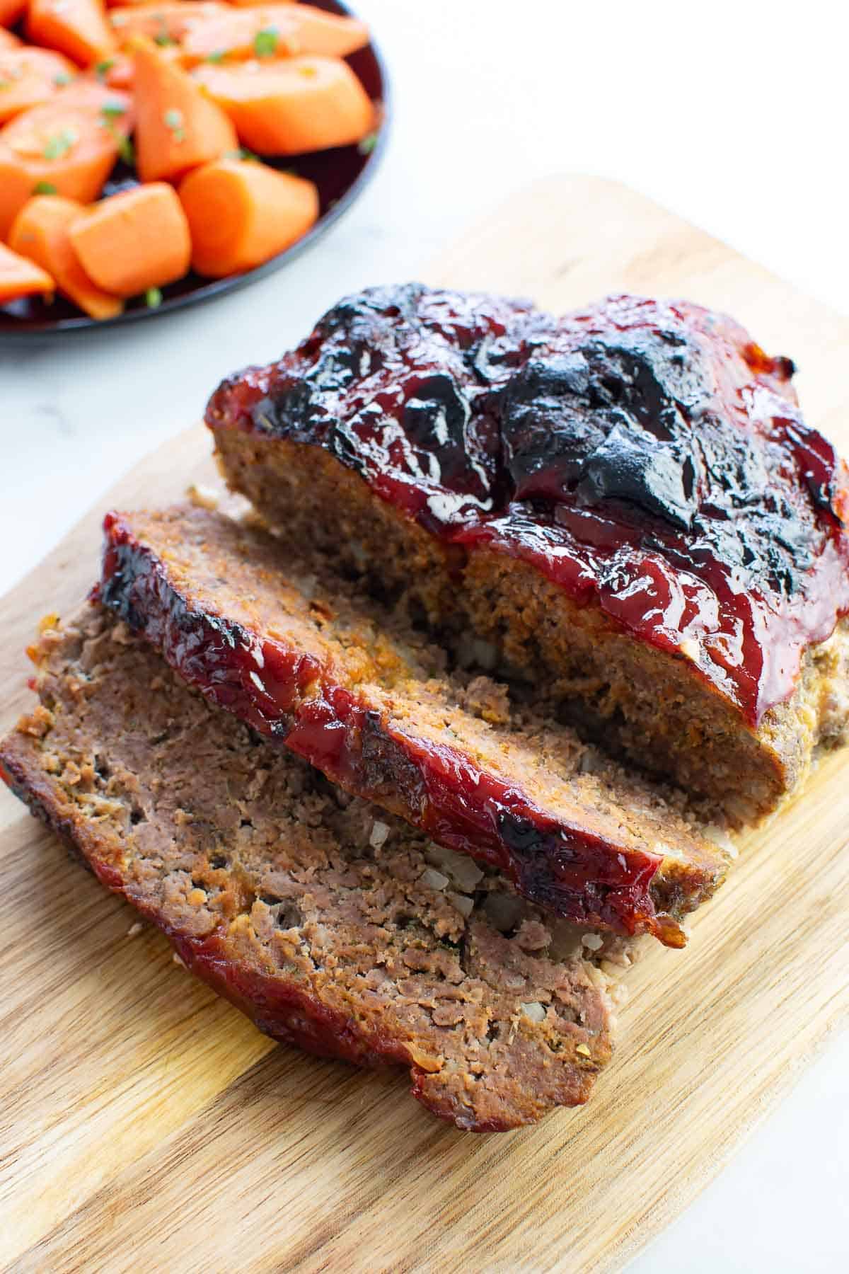 Sliced meatloaf with ketchup glaze.