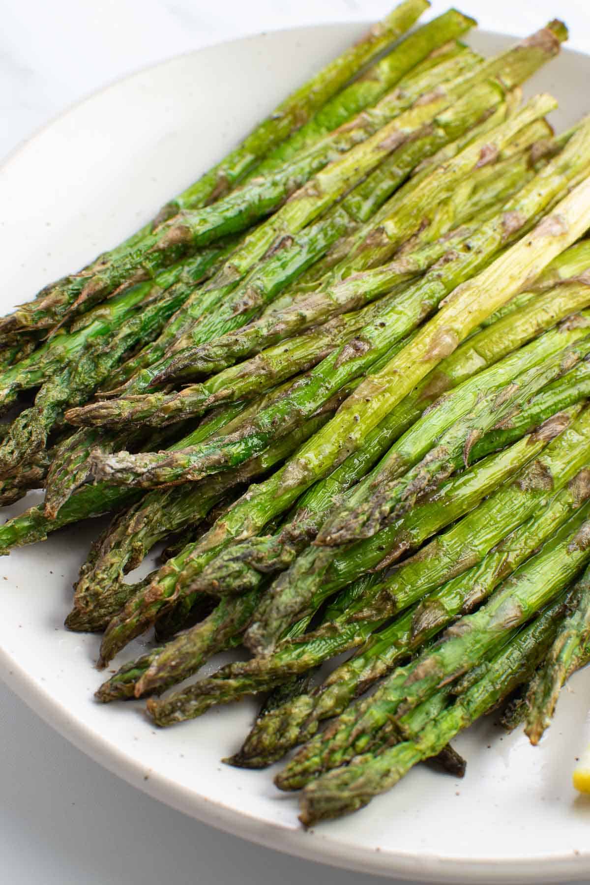 Roasted asparagus on a plate.