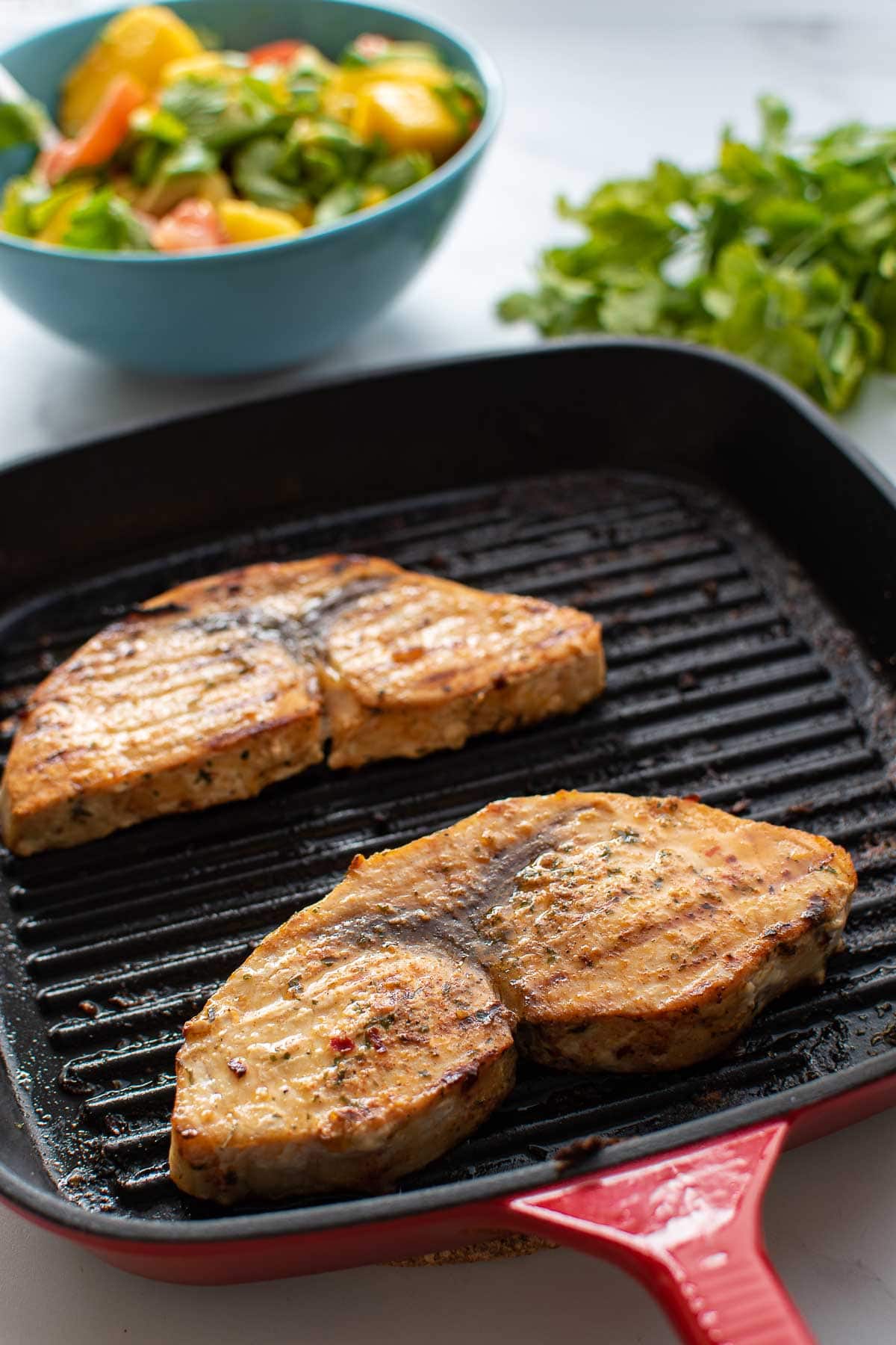 A baking dish with swordfish.